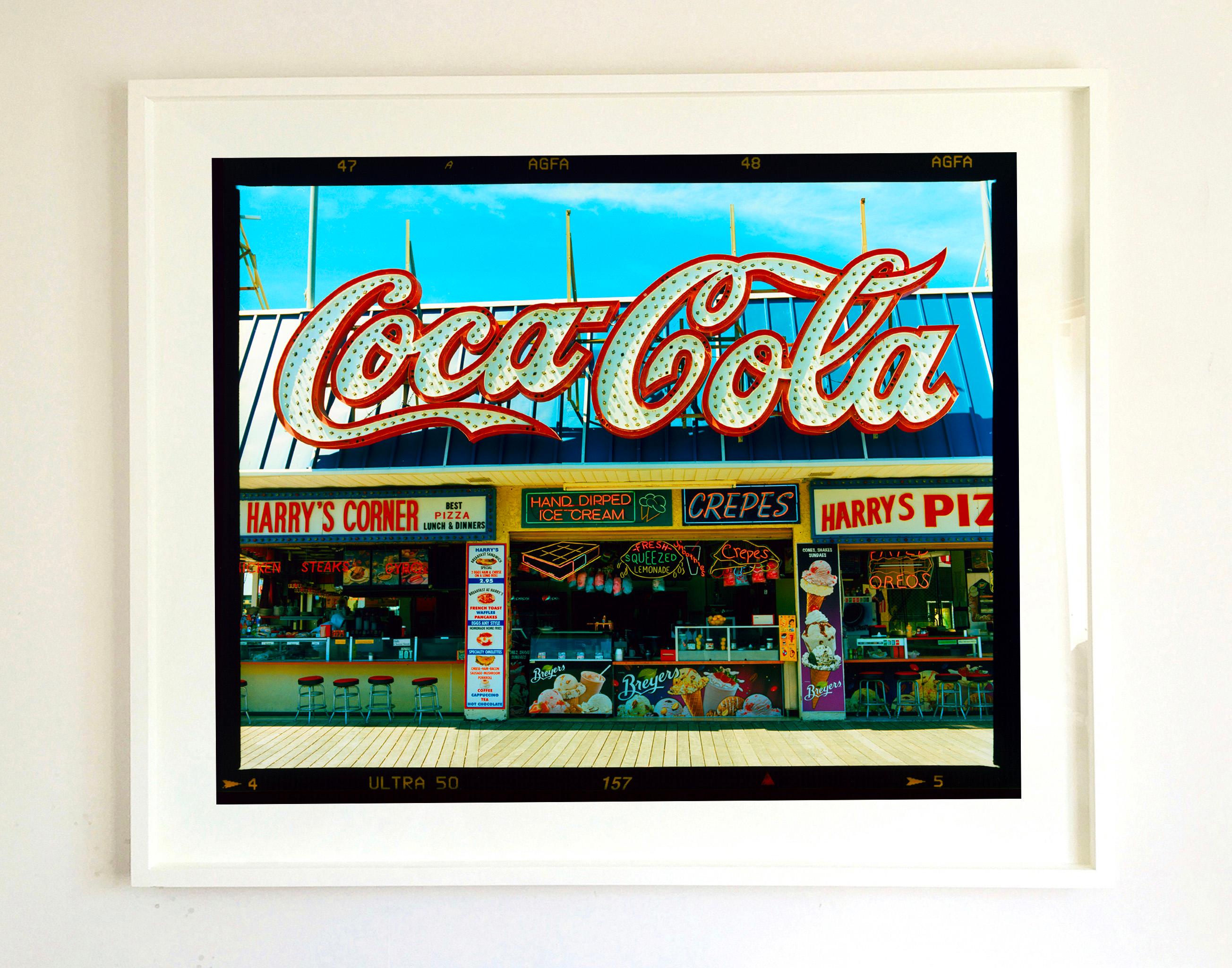 Harry's Corner, on the Wildwood Boardwalk. Taken in April 2013, this picture was first executed in Richard's darkroom in October 2020, he prints it full frame showing the AGFA Ultra film rebate. 
The artwork captures the many details of seaside
