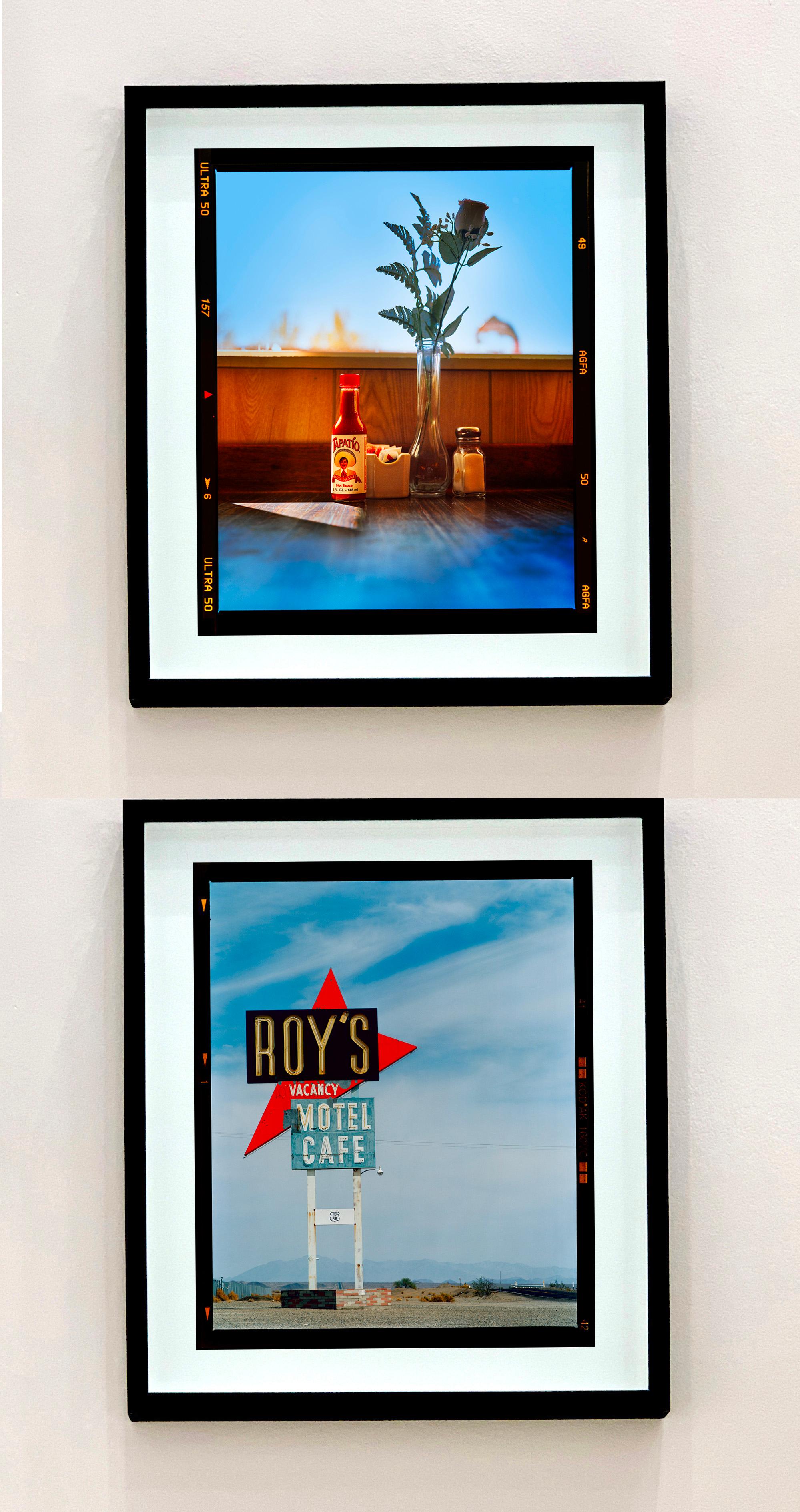 Hot Sauce, Lone Pine, California, photograph from Richard Heeps series Dream in Color.
This interior vignette captures the table of a classic American diner. The color combination of warm hues and blues are a seductive backdrop to the modest table