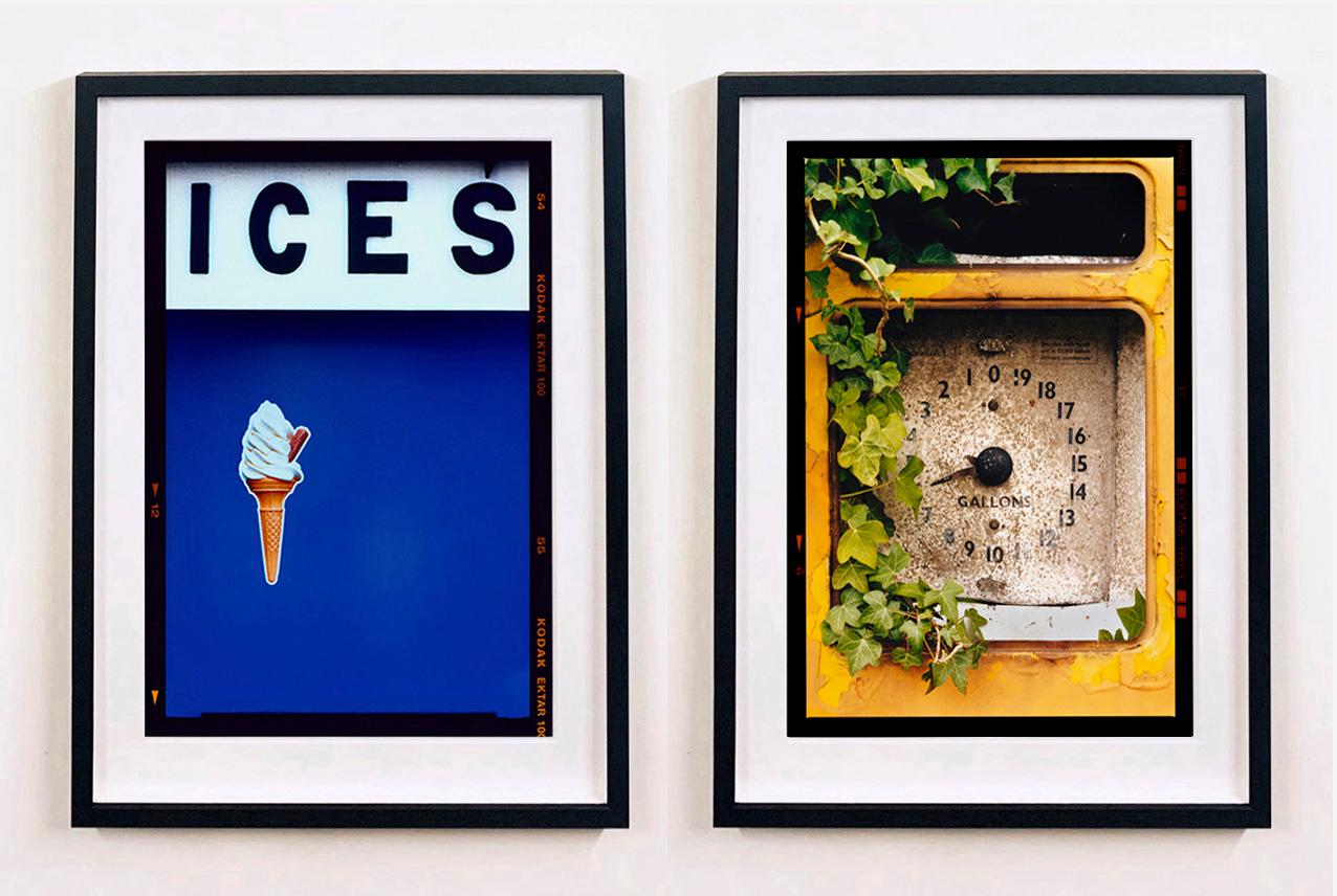 ICES, by Richard Heeps, photographed at the British Seaside at the end of summer 2020. This artwork is about evoking memories of the simple joy of days by the beach. The deep blue color blocking, typography and the surreal twist of the suspended ice