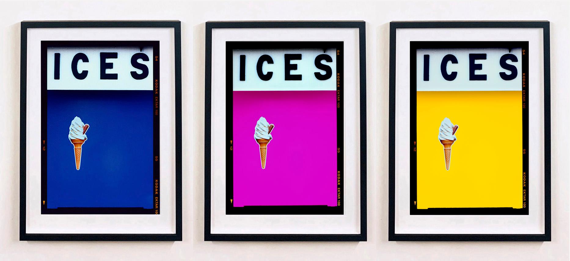 ICES, by Richard Heeps, photographed at the British Seaside at the end of summer 2020. This artwork is about evoking memories of the simple joy of days by the beach. The bold yellow color blocking, typography and the surreal twist of the suspended