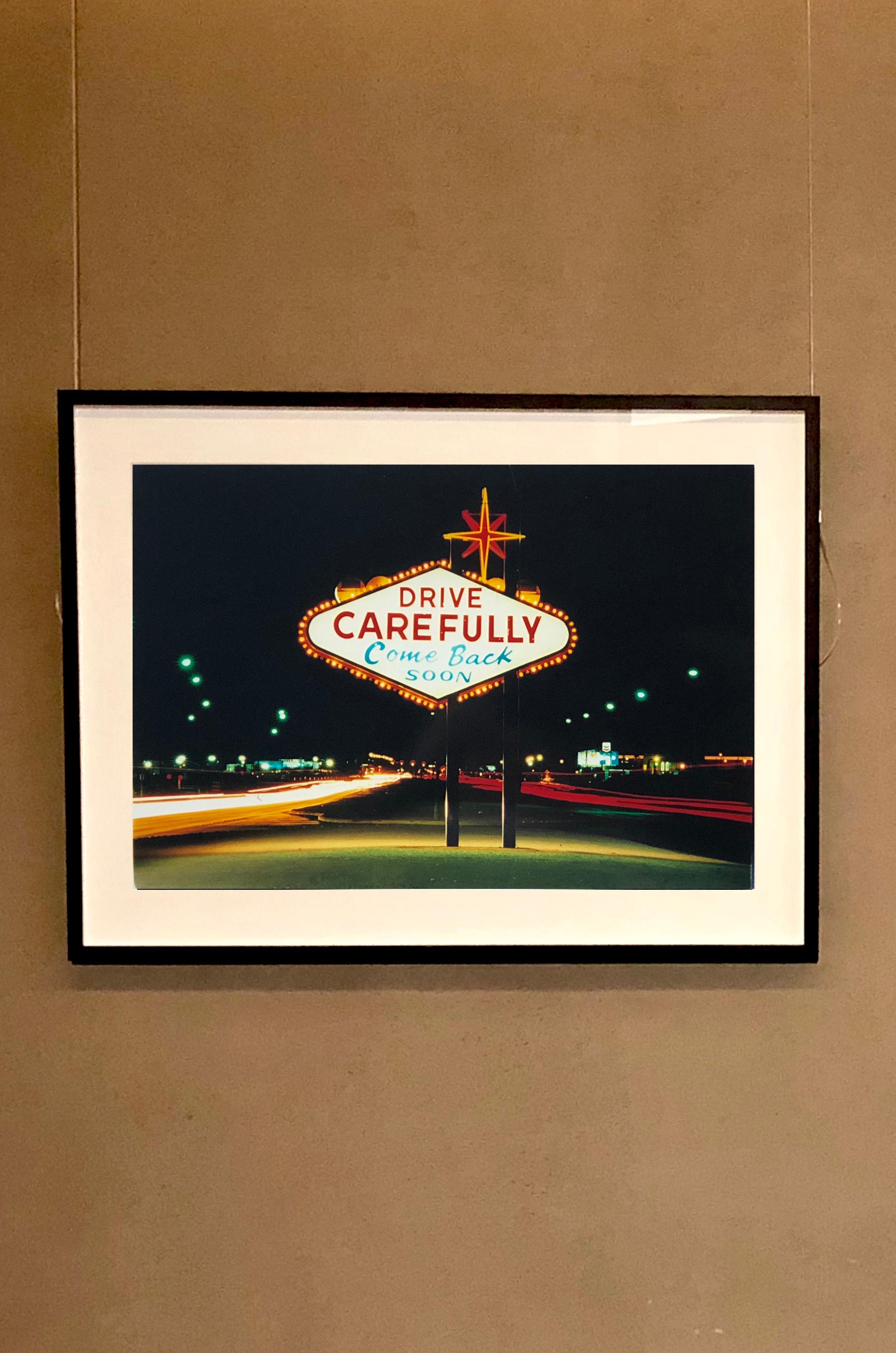 Part of Richard Heeps 'Dream in Colour' Series, here has captured an iconic American sign, with the wonderful sentiment 'Drive Carefully'.

This artwork is a limited edition of 25, gloss photographic print. Accompanied by a signed and numbered