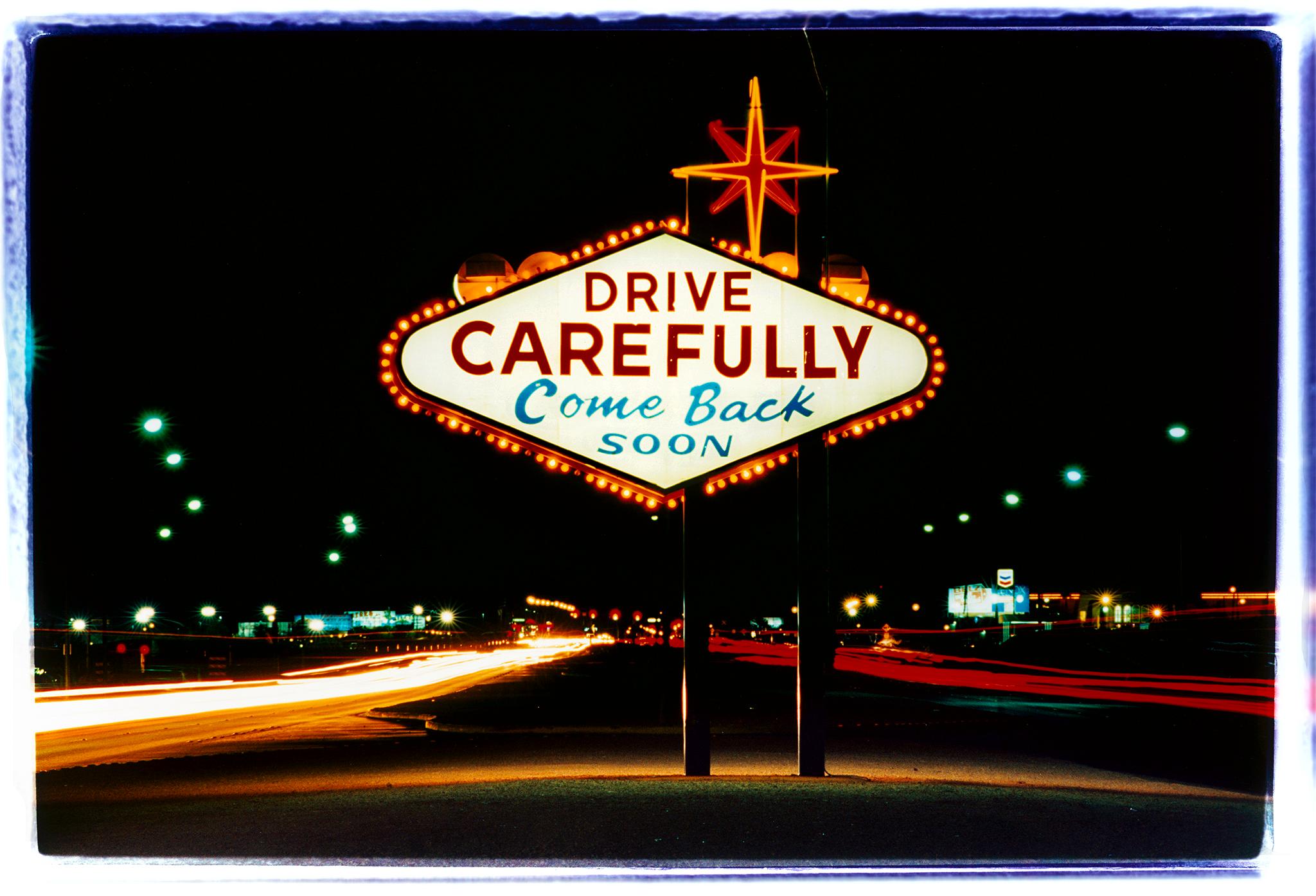 Leaving Las Vegas, photograph from Richard Heeps' 'Dream in Colour' series, this artwork features a classic American neon Googie sign, with the Vegas cityscape lights disappearing into the distance. 

This artwork is a limited edition of 25, gloss