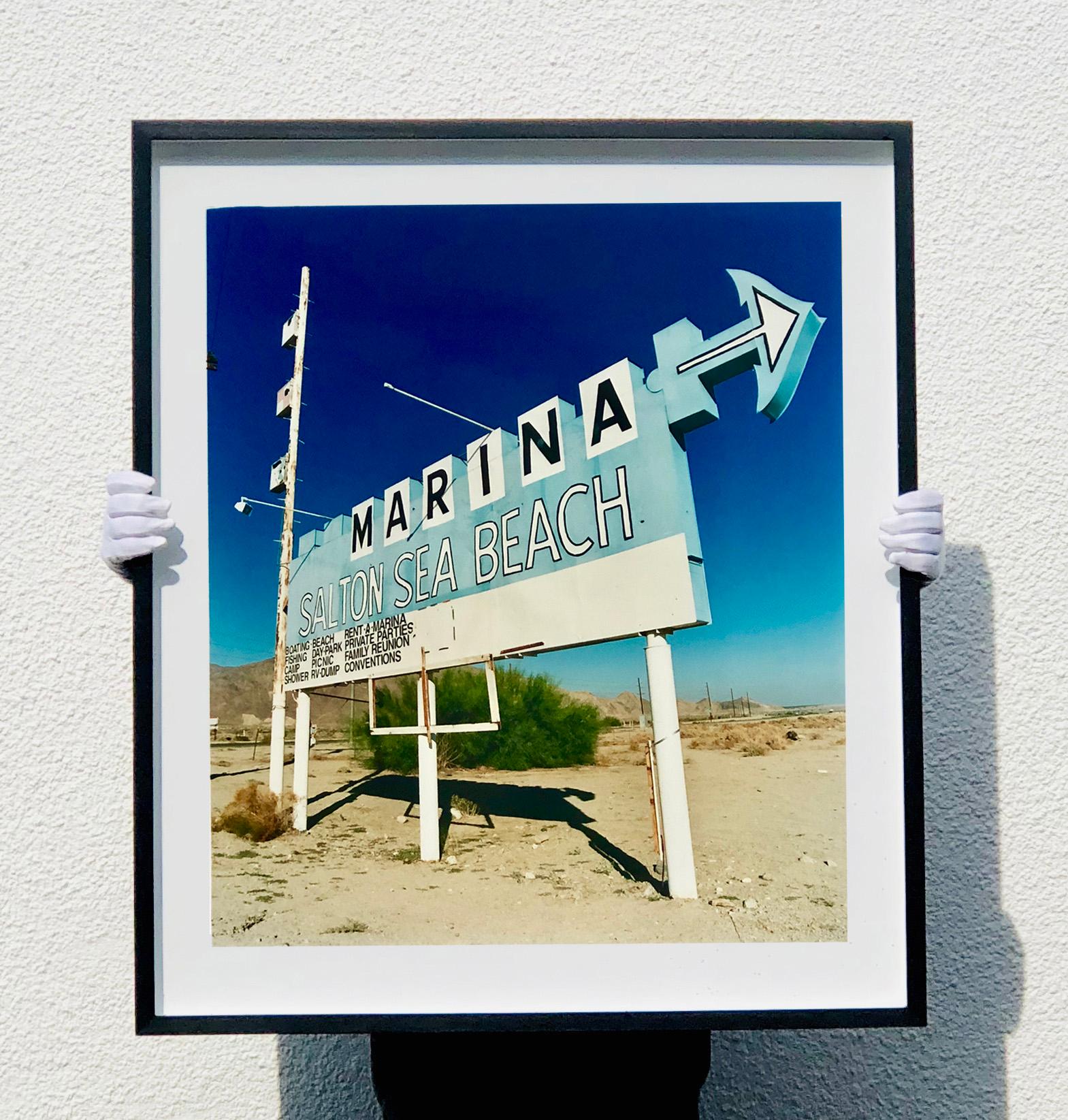 Marina Sign I, Salton Sea Beach, California - Roadside sign color photography - Beige Landscape Photograph by Richard Heeps
