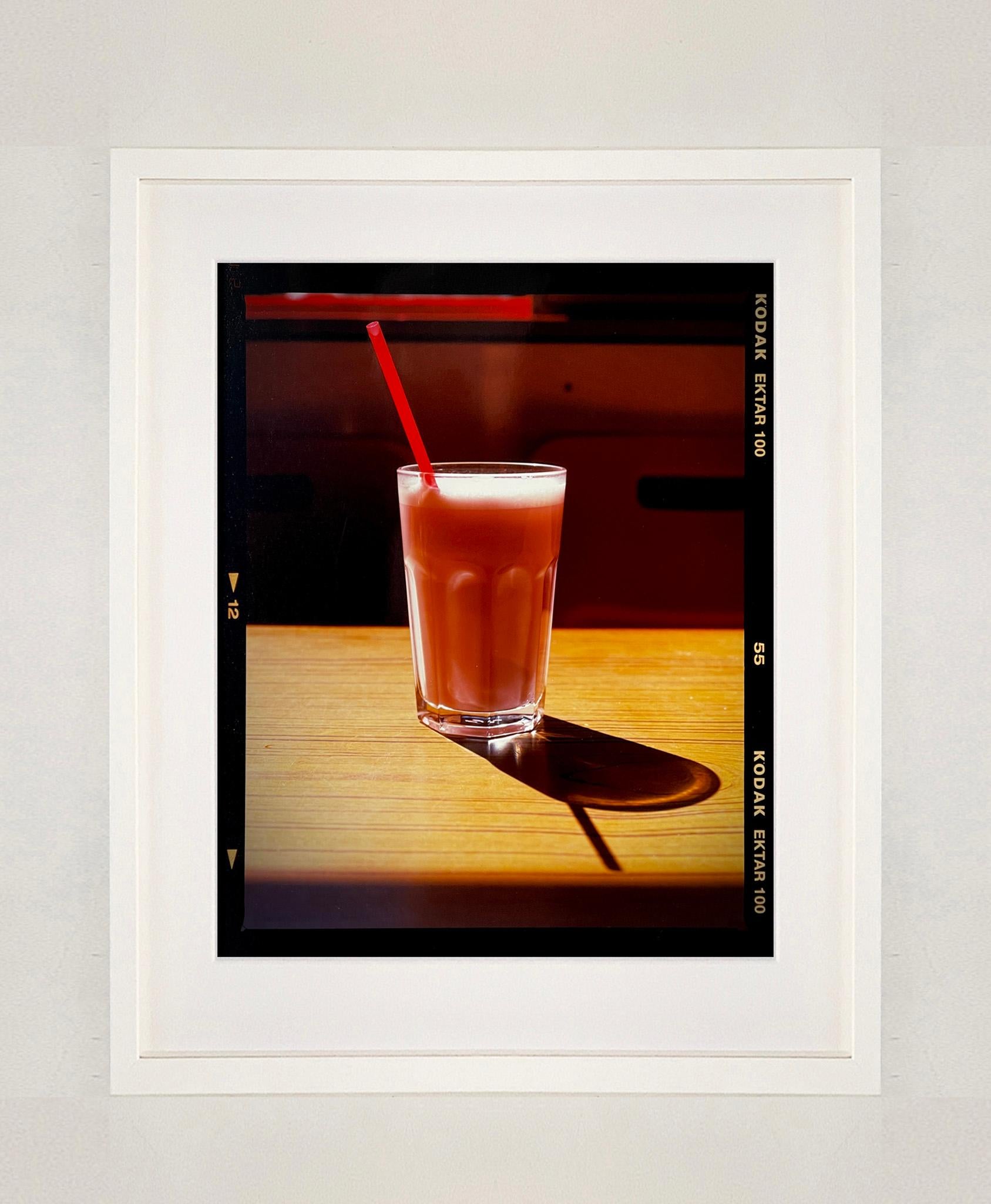 Milkshake, a cold drink on a hot day, captured at the seaside in the year of the great British staycation. This enticing pink milkshake in a glistening glass was photographed by Richard Heeps in a Clacton-on-Sea cafe. The composition of this artwork