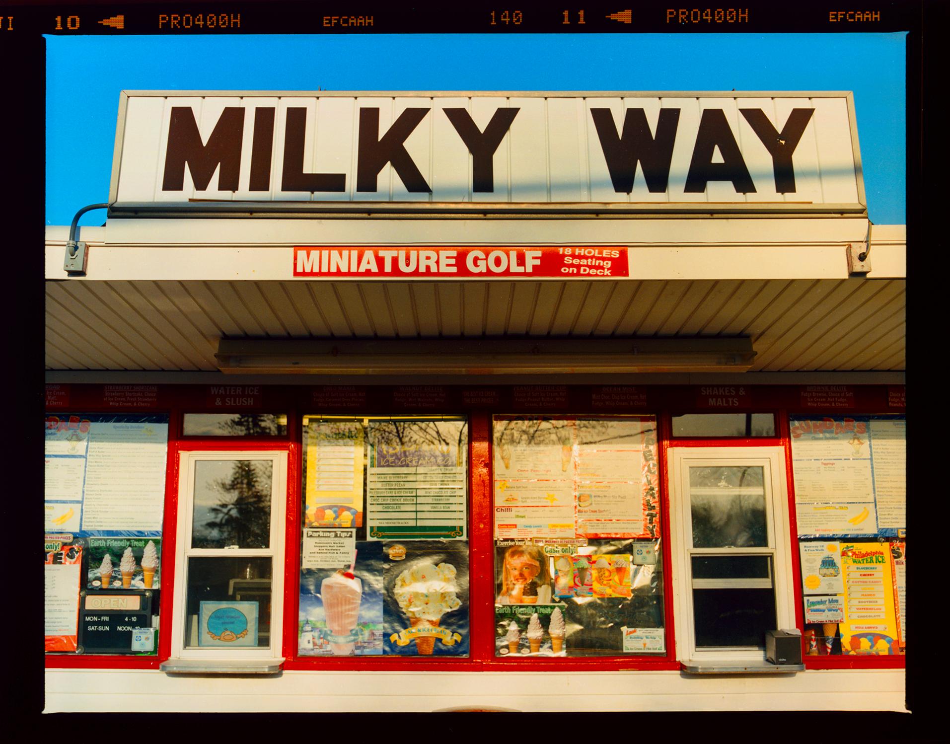 'Milky Way' on the road to Cape May from Richard Heeps Jersey Shore series. Taken in April 2013, this picture was first executed in Richard's darkroom in October 2020, he presents it full frame showing the film rebate. 
This roadside America
