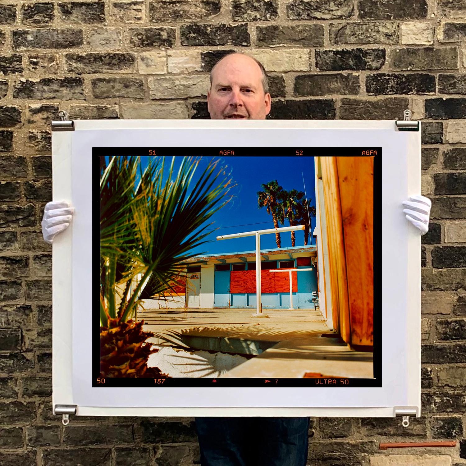 Motel Desert Shores, photograph from Richard Heeps Salton Sea series. This picture has the a vibe of a Southern California American road trip, the colours are so seductive, the palm trees create a desert oasis amongst mid 20th Century architecture.