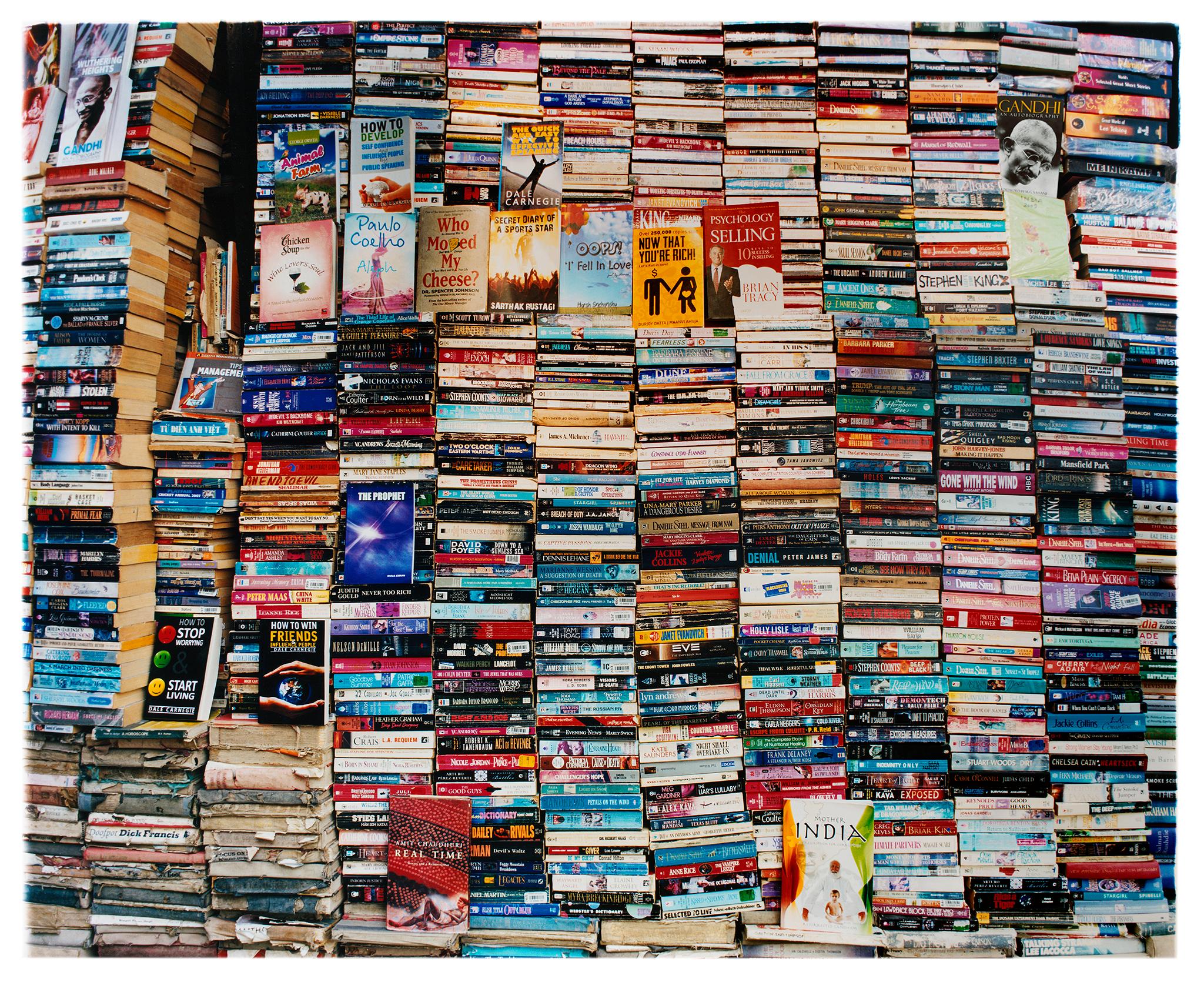 Richard Heeps Color Photograph - Mother India II, Delhi - India Color Street Photograph of Books