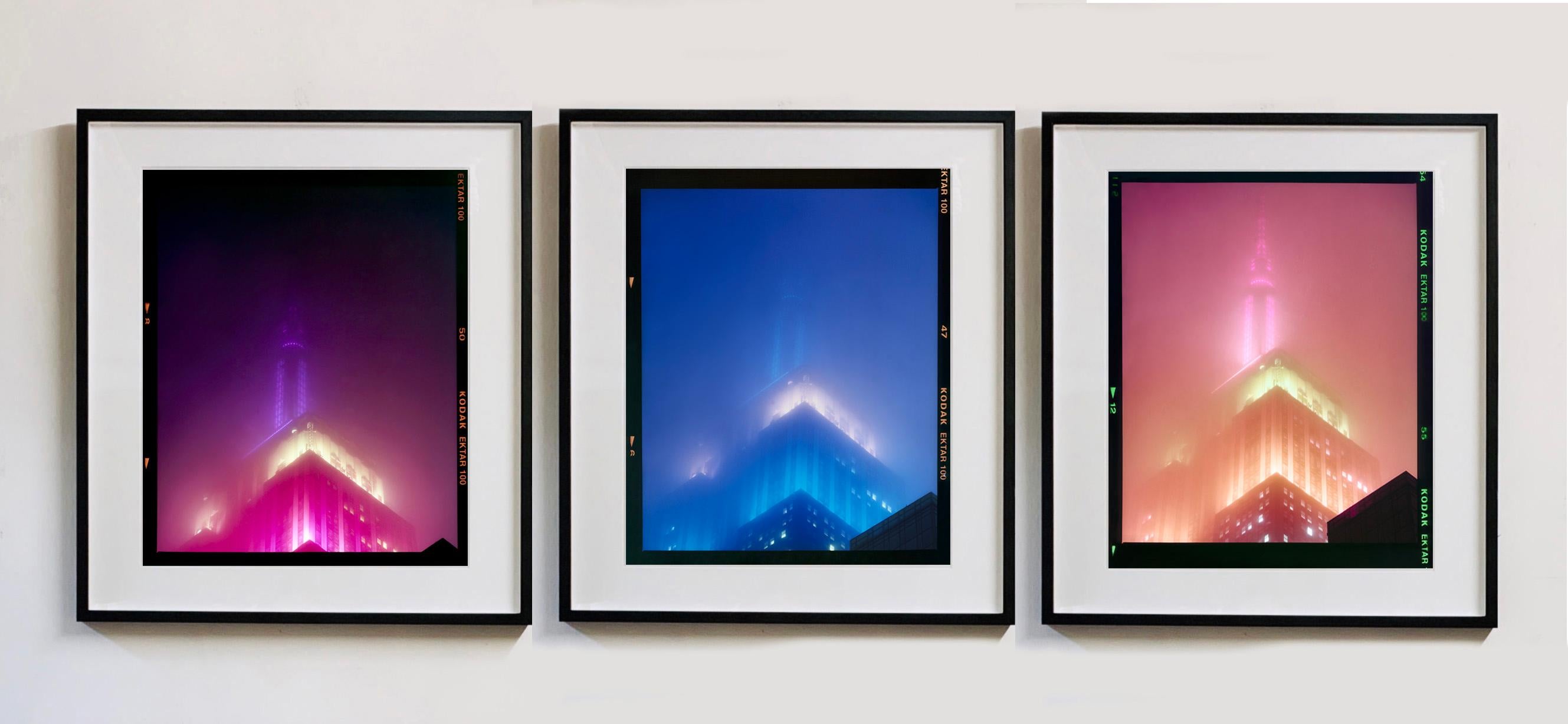 'NOMAD II (Film Rebate)', New York. Richard Heeps has photographed the iconic Empire State building in the mist. The NOMAD sequence of photographs capture the art deco architecture illuminated by changing colours, and is part of Richard's street