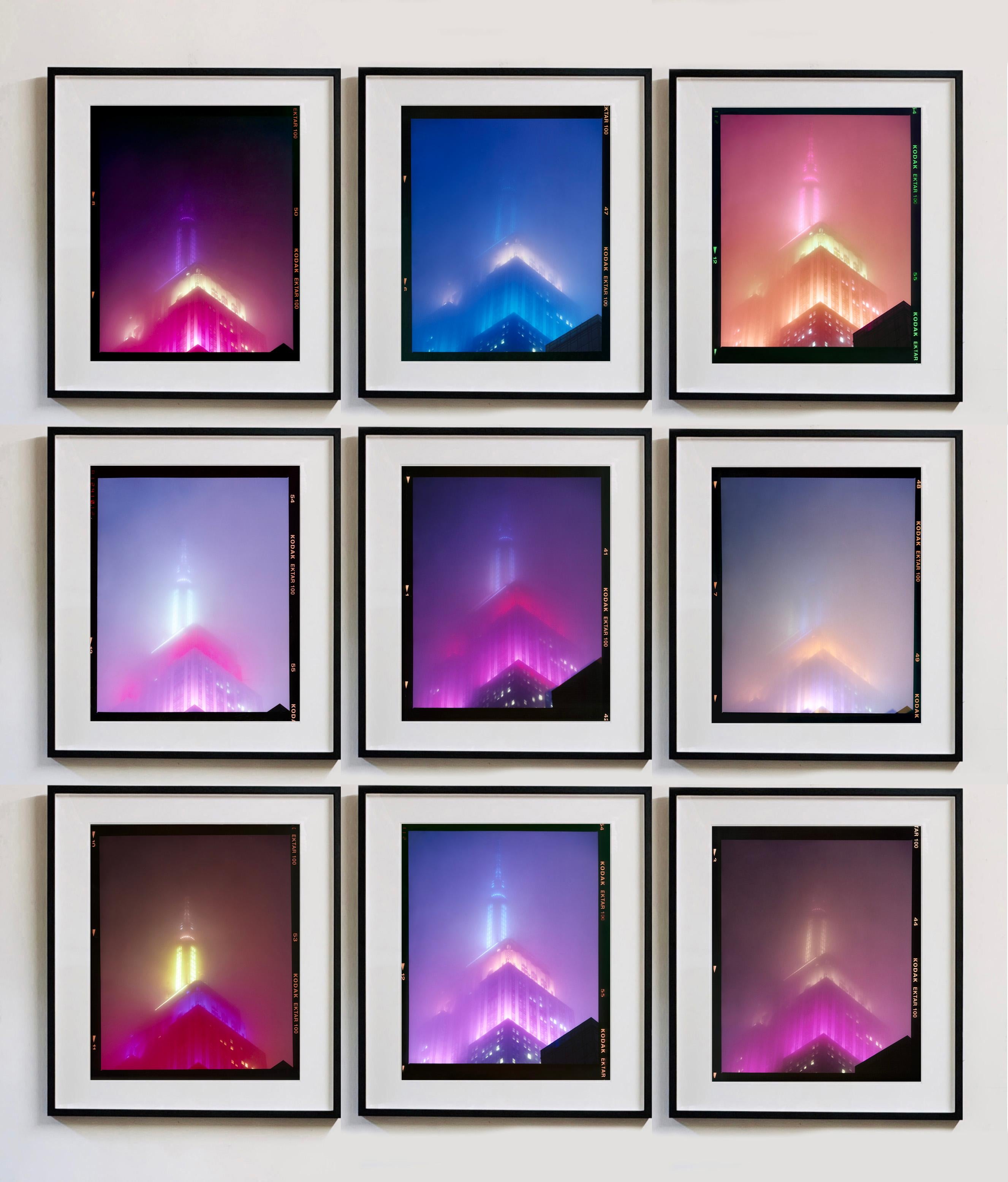 'NOMAD IV (Film Rebate)', New York. Richard Heeps has photographed the iconic Empire State building in the mist. The NOMAD sequence of photographs capture the art deco architecture illuminated by changing colours, and is part of Richard's street