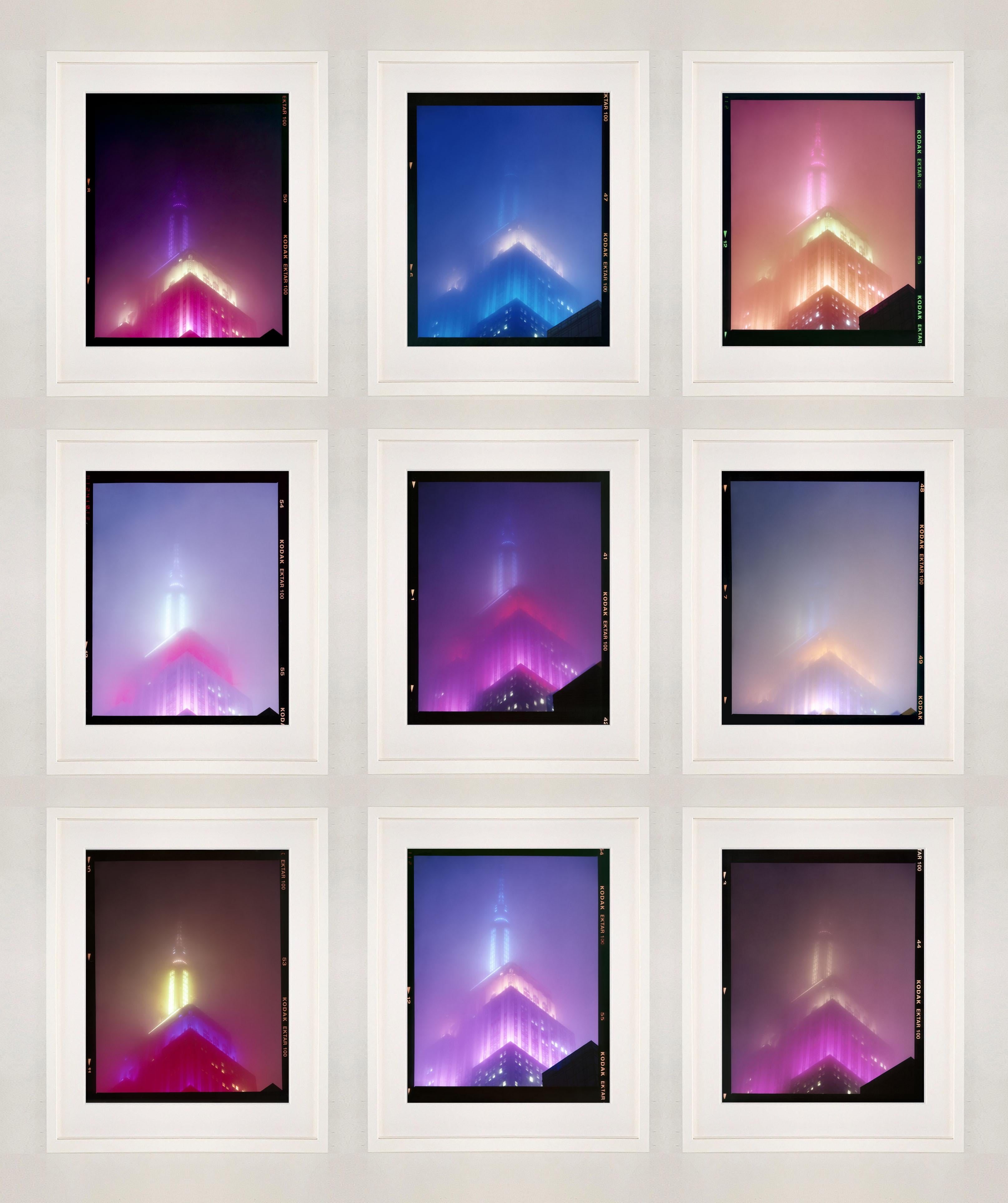 'NOMAD V (Film Rebate)', New York. Richard Heeps has photographed the iconic Empire State building in the mist. The NOMAD sequence of photographs capture the art deco architecture illuminated by changing colours, and is part of Richard's street