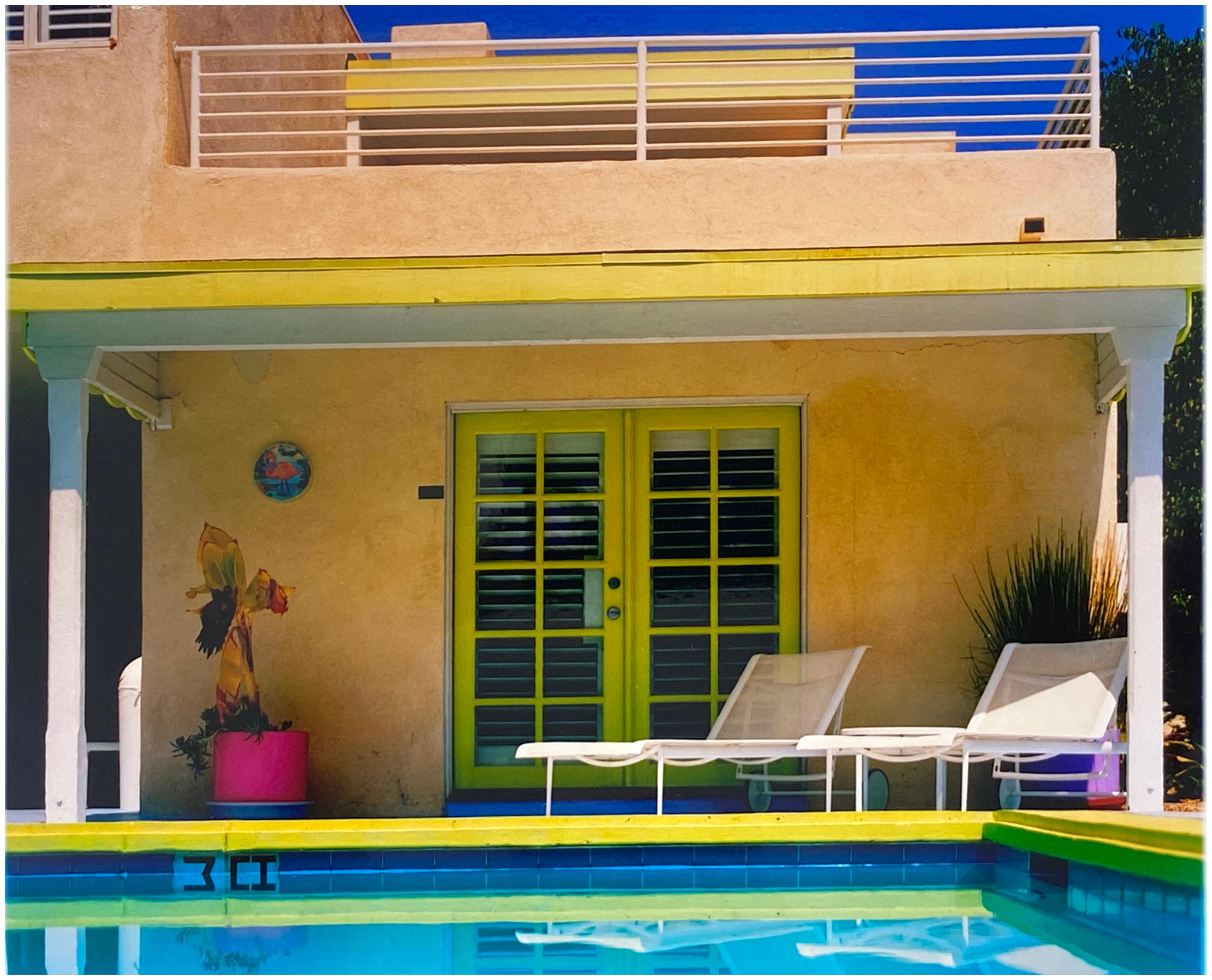 Palm Springs Poolside, photography by Richard Heeps at Ballantines Movie Colony. This artwork captures the classic mid-century Palm Springs architecture set against saturated blue skies and the cool pool with accents of pink and almost neon