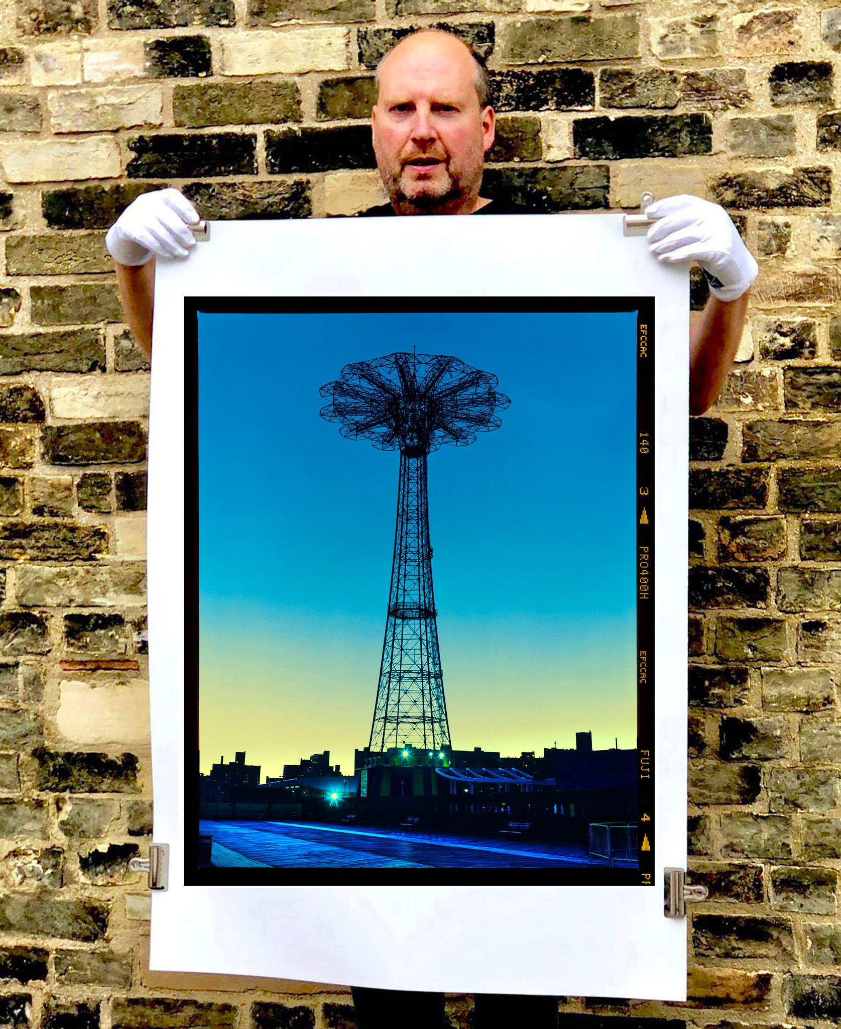 The iconic Coney Island structure, Parachute Jump, photography by Richard Heeps, printed from negative full frame with the Fuji Film border. 

This artwork is a limited edition of 25, gloss photographic print, accompanied by a signed and numbered