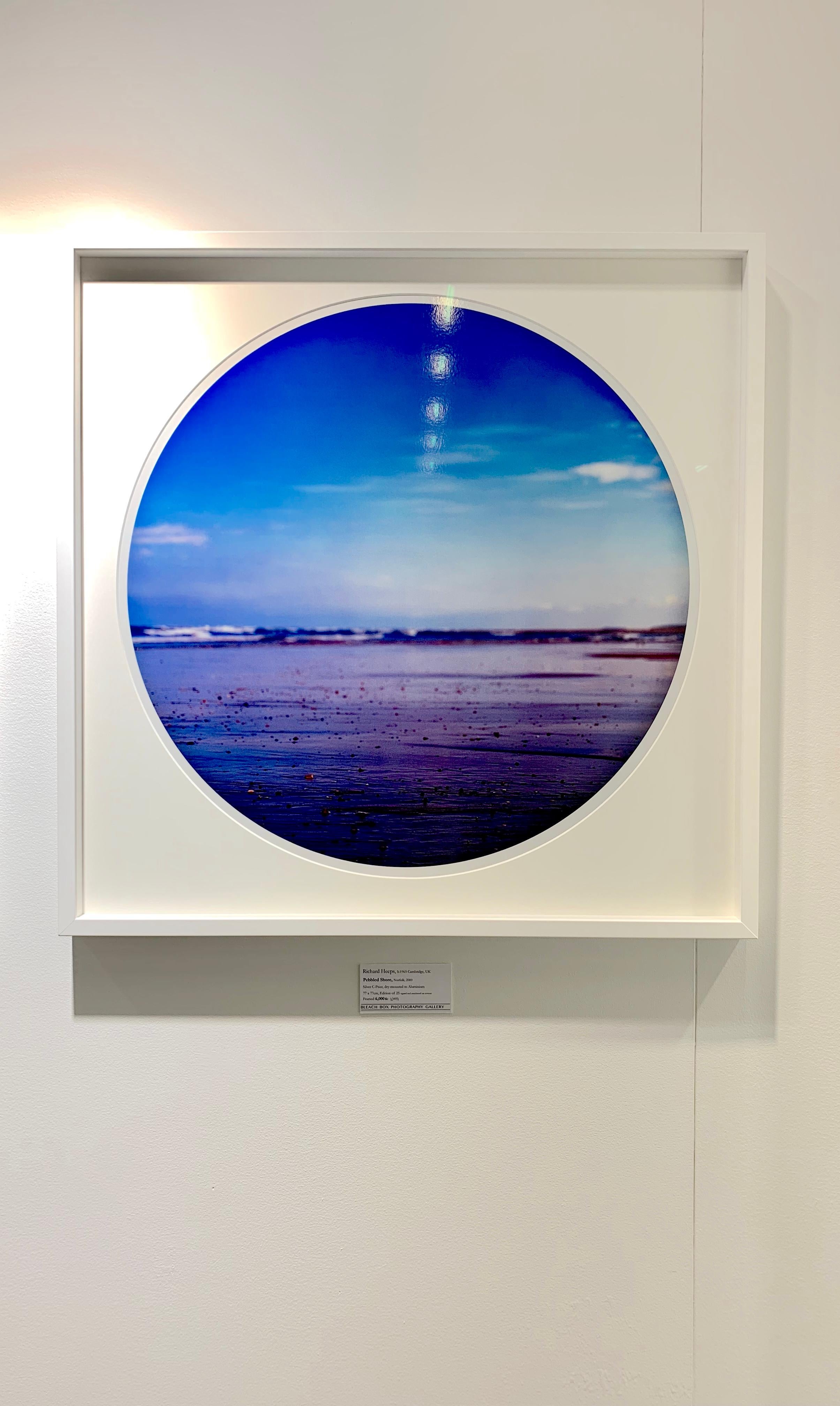Pebbled Shore, Norfolk - Contemporary, Circle, Waterscape Photography - Blue Color Photograph by Richard Heeps