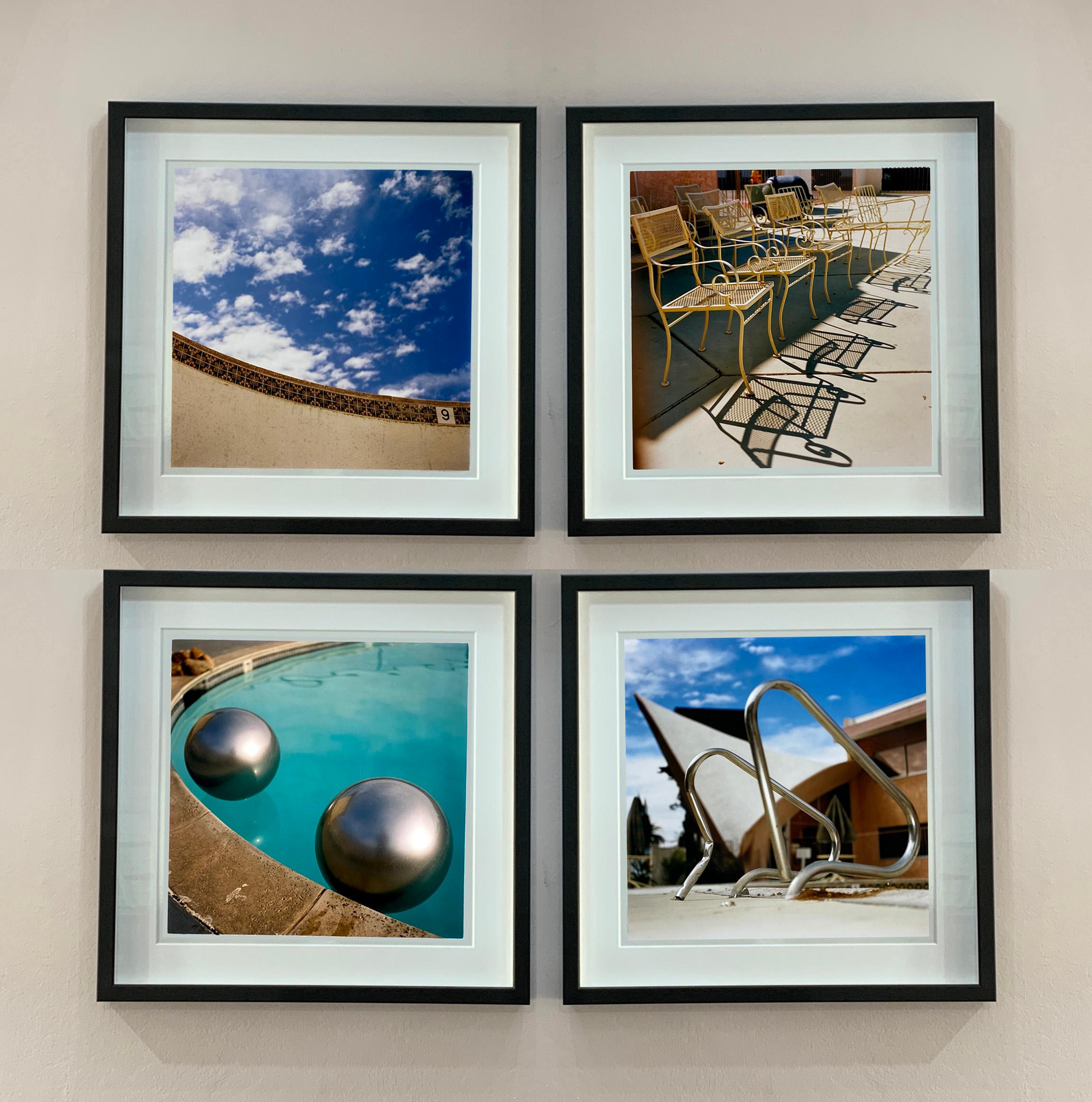 Metallic silver beach balls float on a bright blue pool in Palm Springs California, photography part of Richard Heeps Dream in Colour series.

This artwork is a limited edition of 25, gloss photographic print, presented in a museum board white