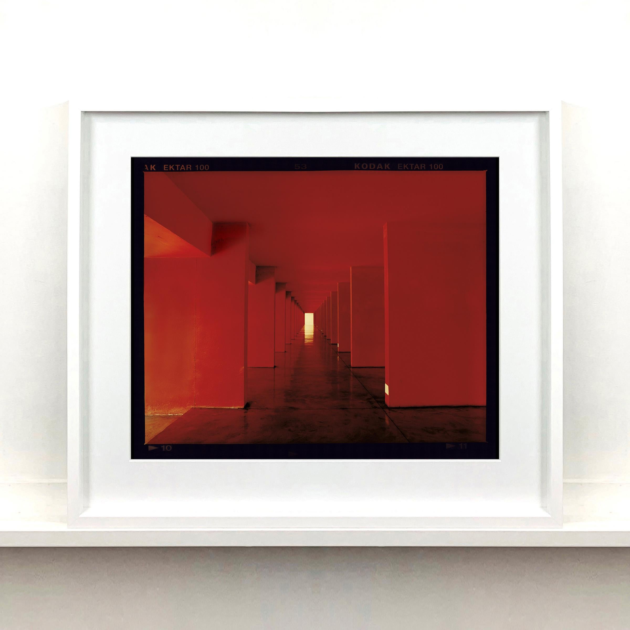 Red Dinosaur II, Milan - Architectural urban color photography - Contemporary Print by Richard Heeps