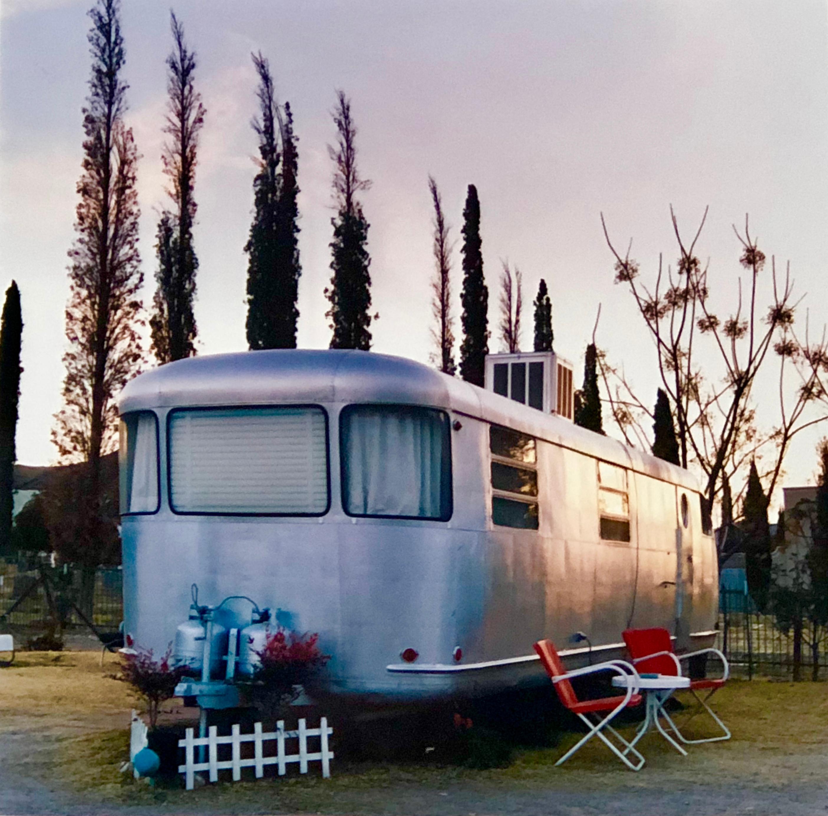 Royal Mansion at Dawn, photograph from Richard Heeps Dream in Color series. Photographed in Arizona this artwork has the classic Americana road trip feel, the pastel colors and the aluminium airstream have a peaceful feeling in the dawn light.

This