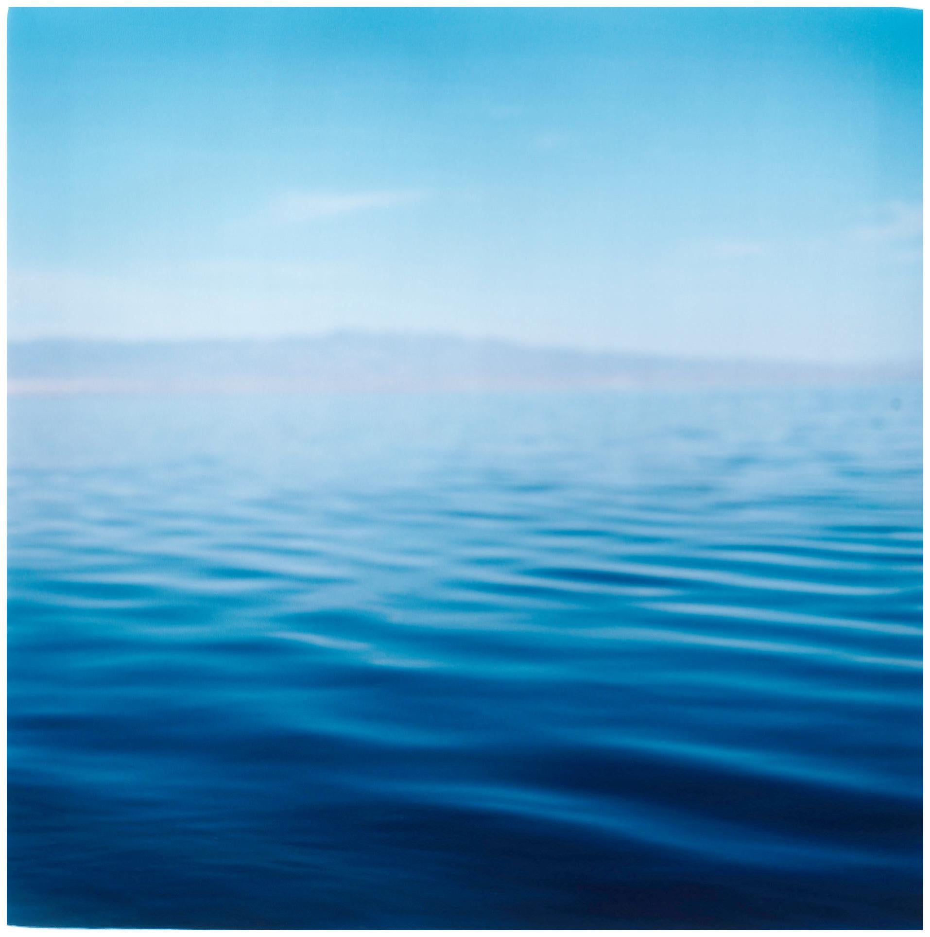 Shades of blue in this peaceful, almost abstract photograph of the Salton Sea, California. Artwork by film photographer Richard Heeps printed from negative in his darkroom.

This artwork is a limited edition of 25, gloss photographic print,