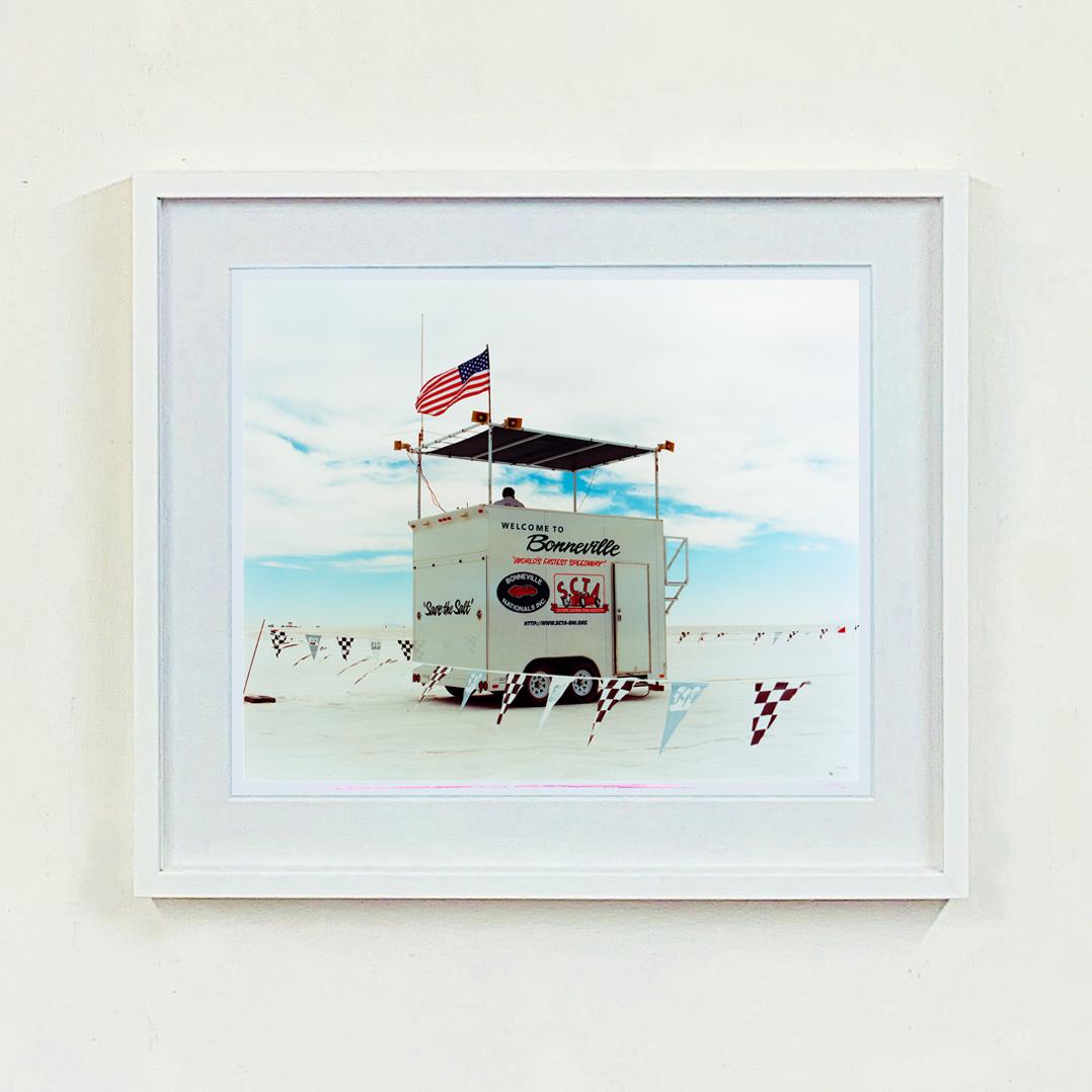 'Save the Salt' refers to the mission of caring for the unique environment of the Salt Lake. This picture instantly has a cool Americana feel. The Control Tower and the chequered flag point to the famous Bonneville Speedway home to Sir Malcolm