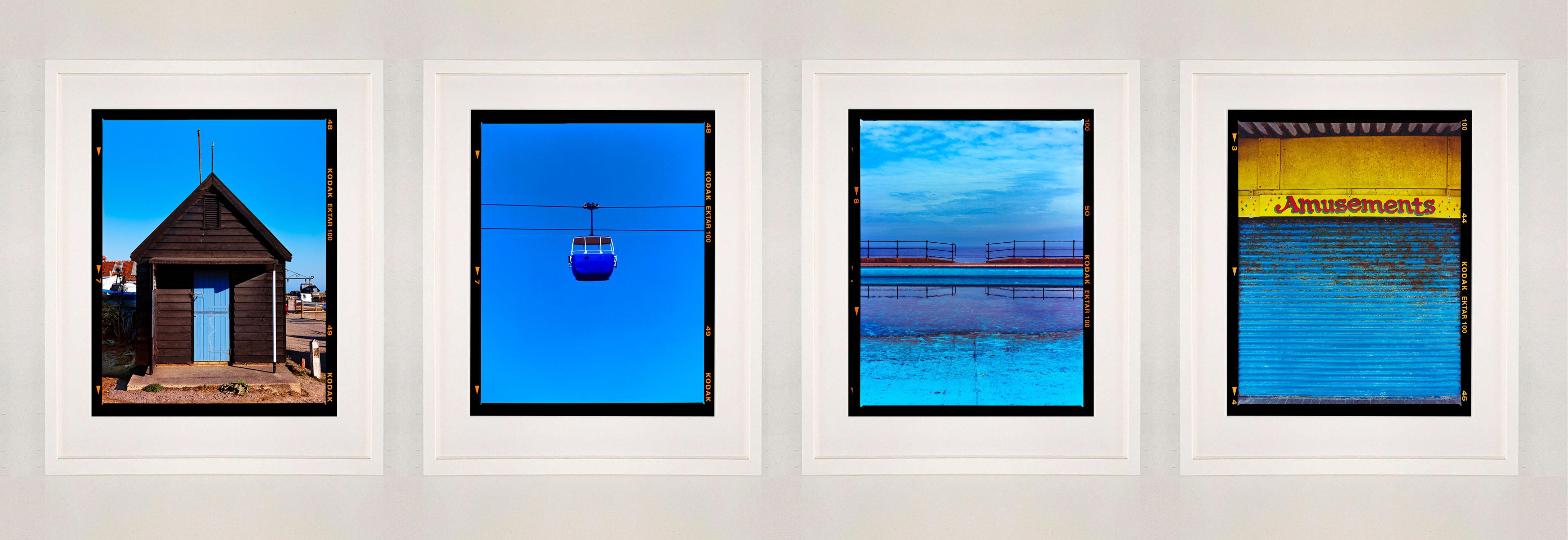 Set of Four Framed Artworks British Blue Seaside Holiday Collection - Contemporary Print by Richard Heeps