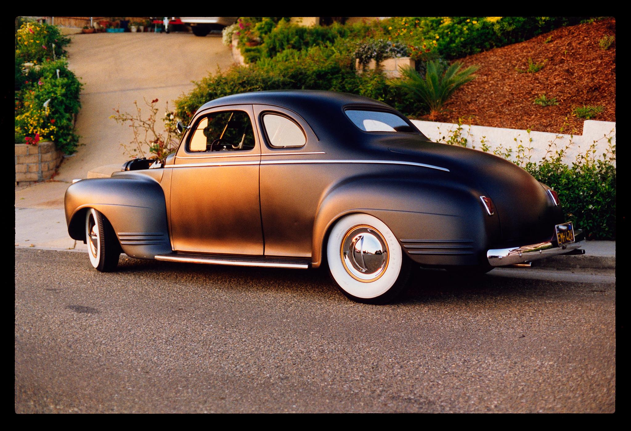 Richard Heeps Portrait Photograph - Shelley's '41 Plymouth, California - American Road Trip Color Photograph