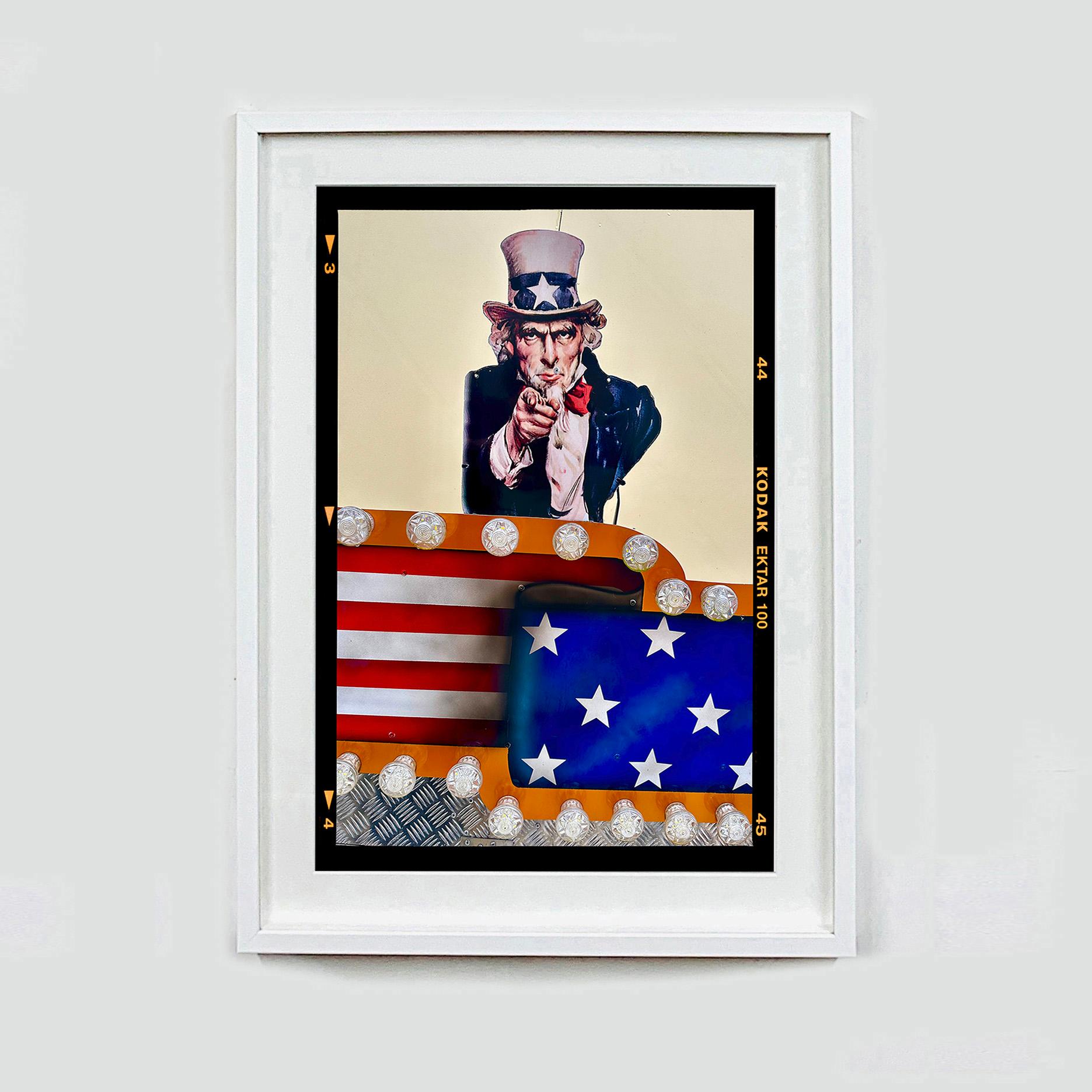 Stars and Stripes Sam, photograph from Richard Heeps' On-Sea series. The historic Uncle Sam is brought to life in this surreal street photography with the Kodak film border.

This artwork is a limited edition of 25, gloss photographic print,