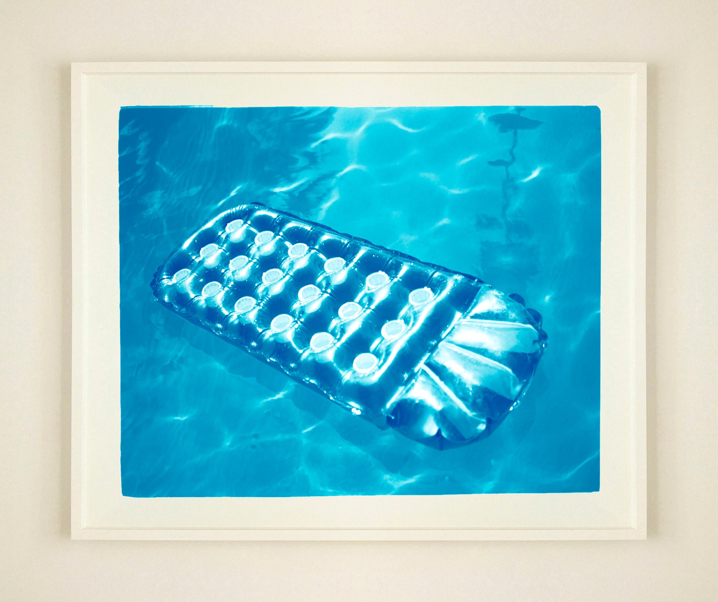 Sun Lounger, Palm Springs photograph by Richard Heeps from his Dream in Color series.
There is something idyllic about the blue pool water and the sun lounger just waiting for you.

This artwork is a limited edition of 25, gloss photographic print,