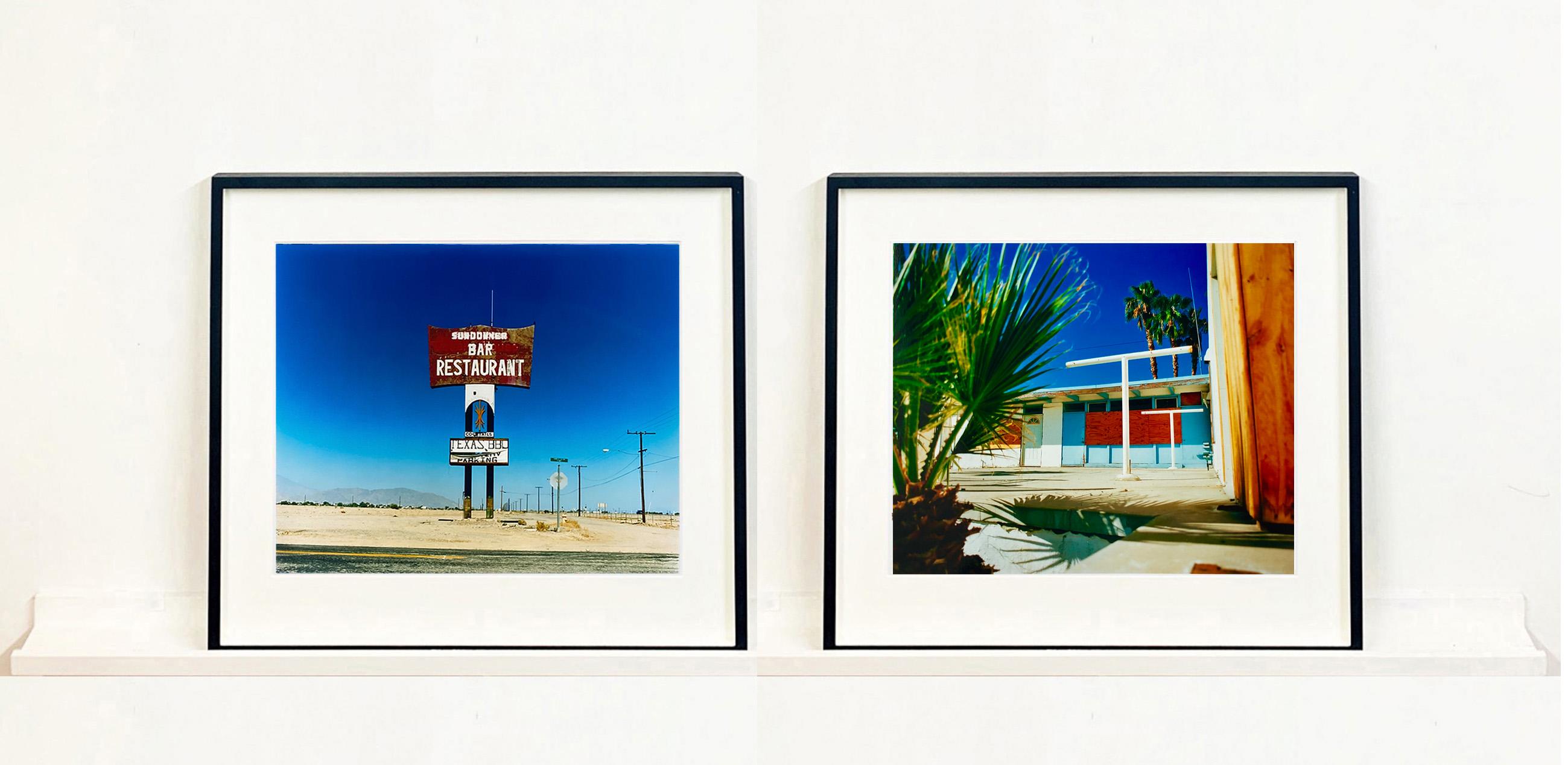 Sundowner, this isolated giant great roadside sign set against a vast blue sky is a remnant of The Sundowner Bar and Restaurant of the Motel which is unfortunately no more. This photograph, part of Richard Heeps Salton Sea Series captures the