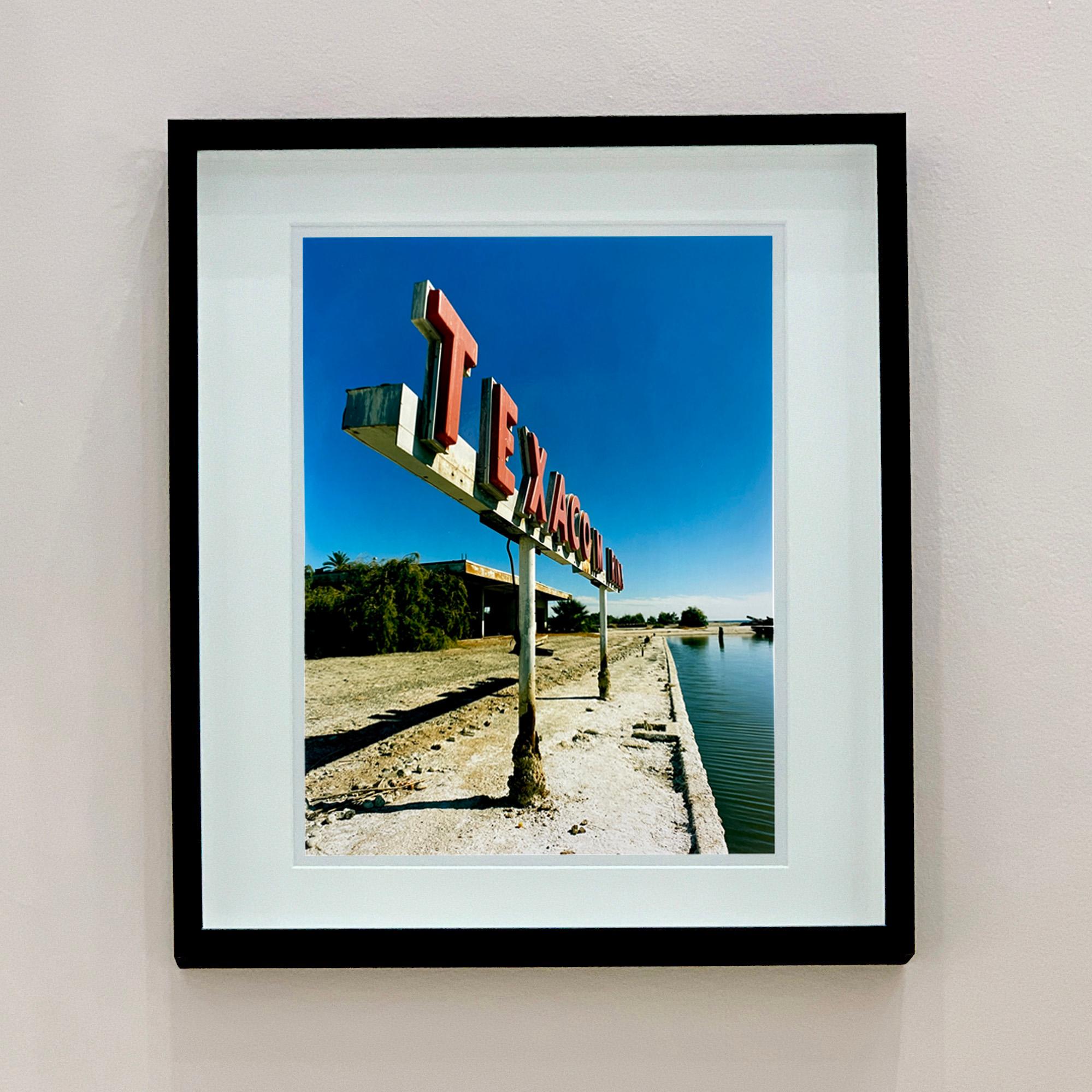 Texaco Marine sign, from Richard Heeps 'Salton Sea' series. This large advertising sign on the bank of California's largest marina, once a popular celebrity mooring point. The sign is no longer there so Richard has captured the iconic past before it