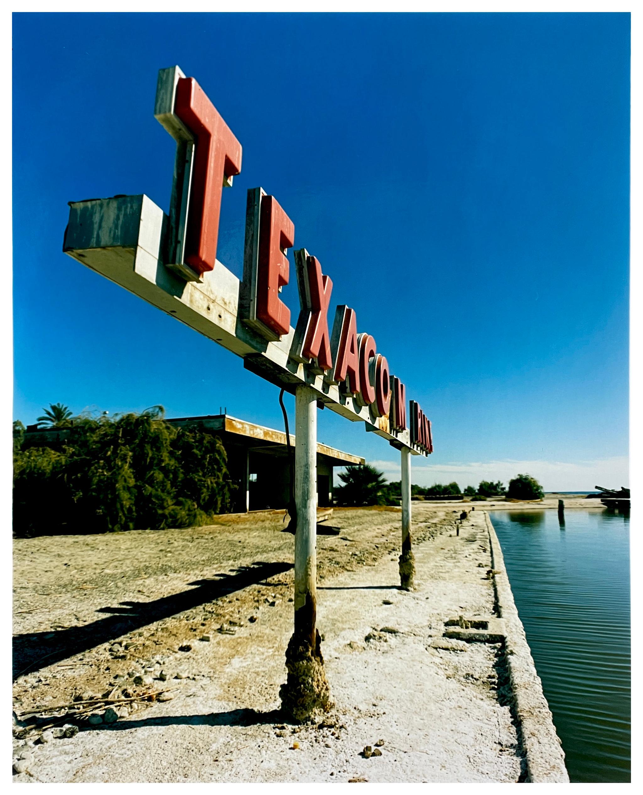 Richard Heeps Landscape Photograph - Texaco Marine Sign & Marina, Salton Sea, California - sign color photography