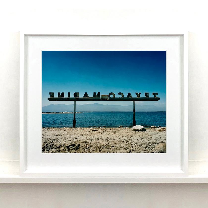 Three Framed Salton Sea Photographs. 
A collection of blue hued landscapes and waterscapes from Richard Heeps travels, American road trips shooting his series Salton Sea. Shot on film these are handprinted from negative in his Cambridge darkroom in