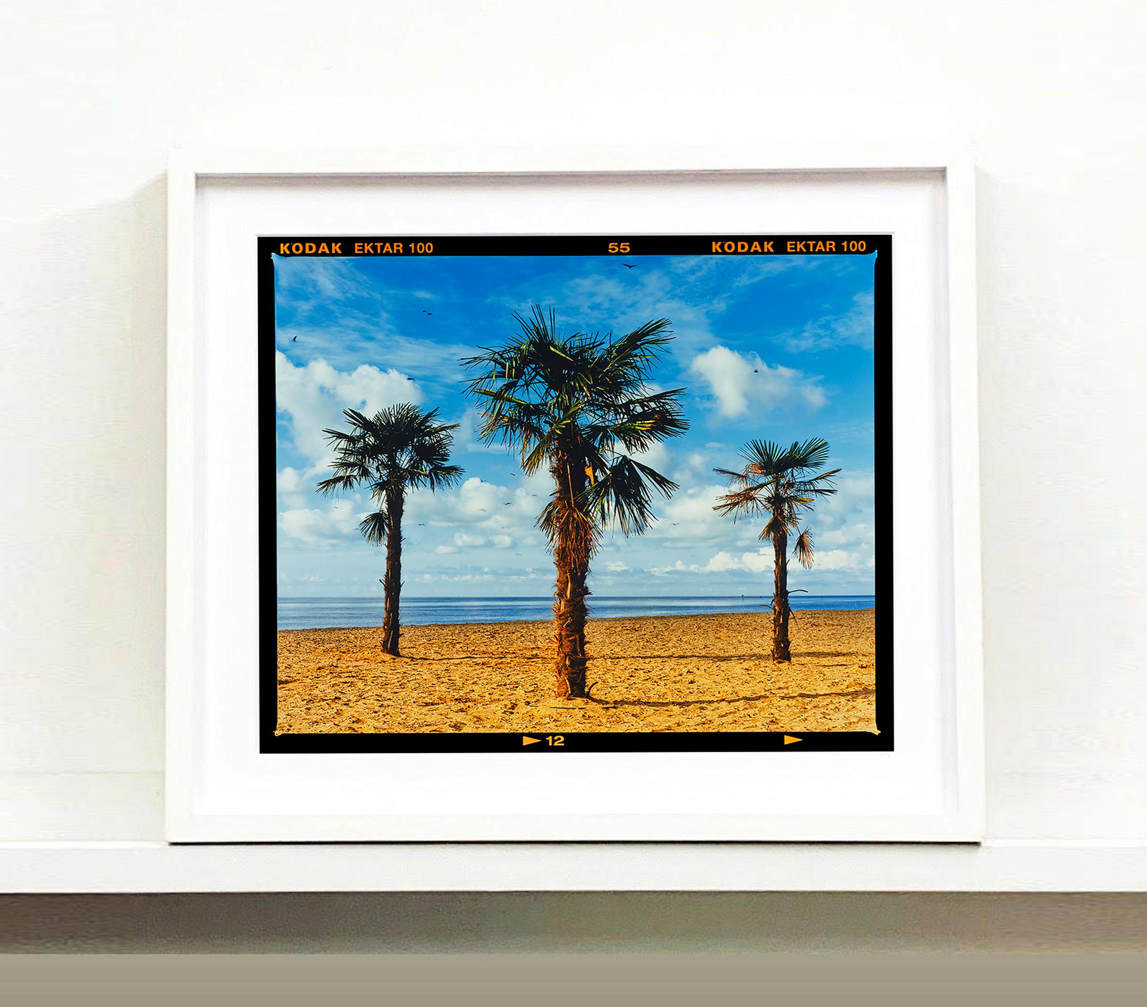 'Three Palms' from Richard Heeps Great British staycation series, On-Sea. Taken in Clacton-on-Sea, Richard was channeling Hitchcock in his mind. He printed in his darkroom full frame with the Kodak film rebate which adds another dimension to this