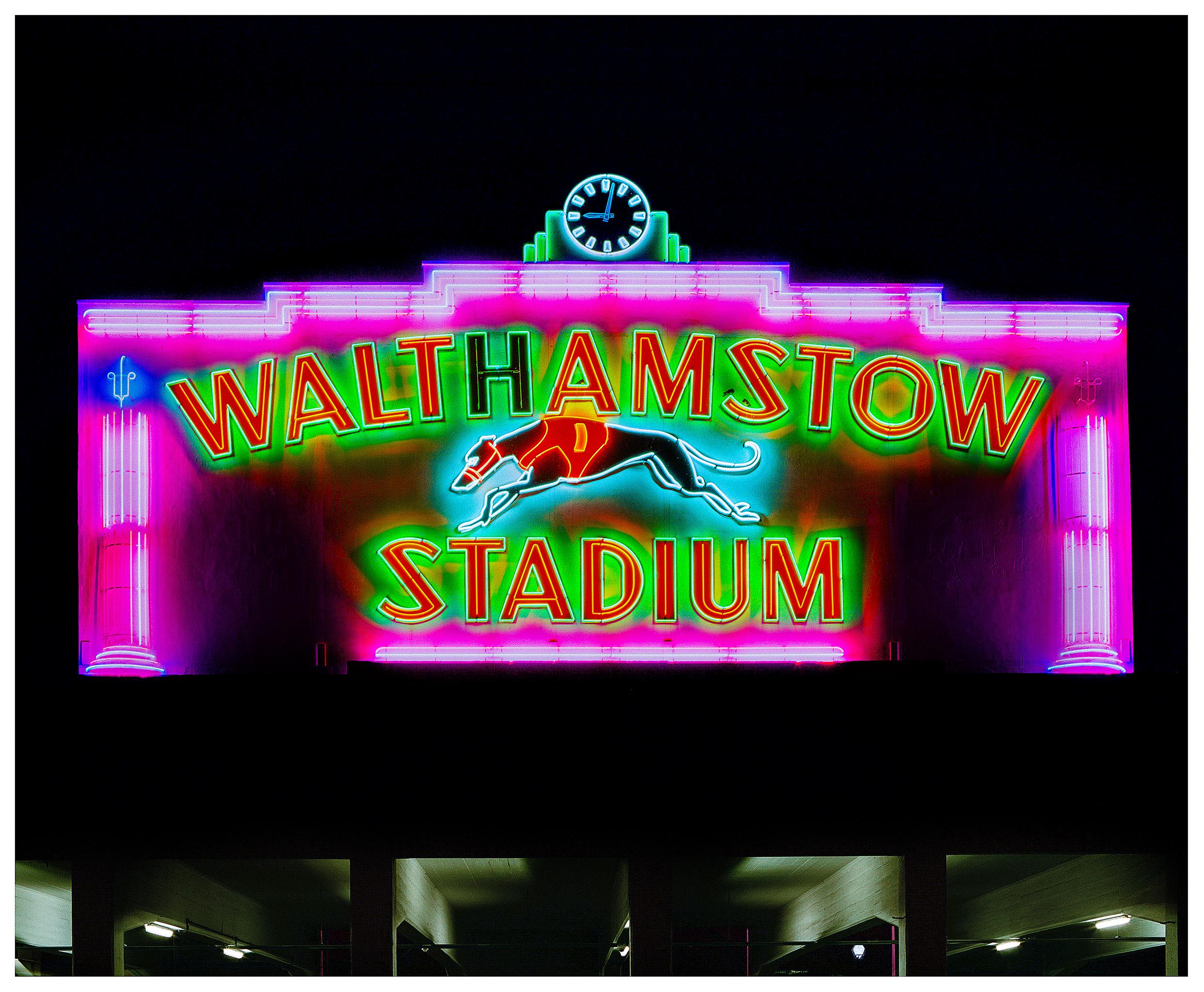 Iconic neon from London's North Circular landmark, the Walthamstow Stadium.

This artwork is a limited edition of 25, gloss photographic print, dry-mounted to aluminium, presented in a museum board white window mount and a choice of black or white