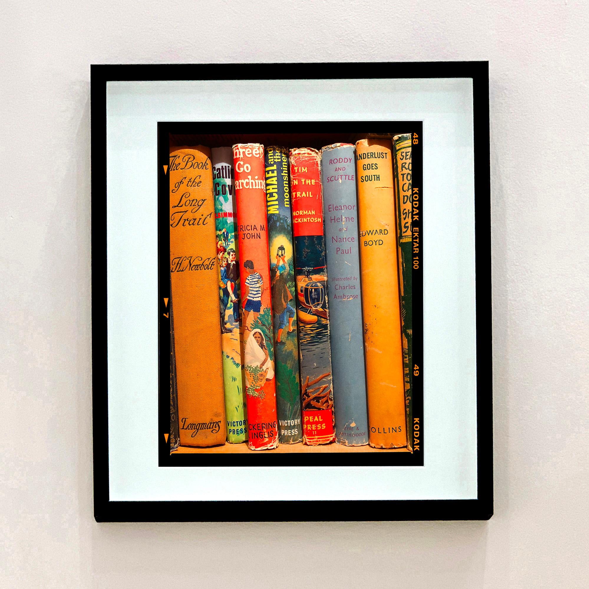 Wanderlust Goes South, Norfolk - Photographie couleur de dos de livres anciens - Orange Color Photograph par Richard Heeps