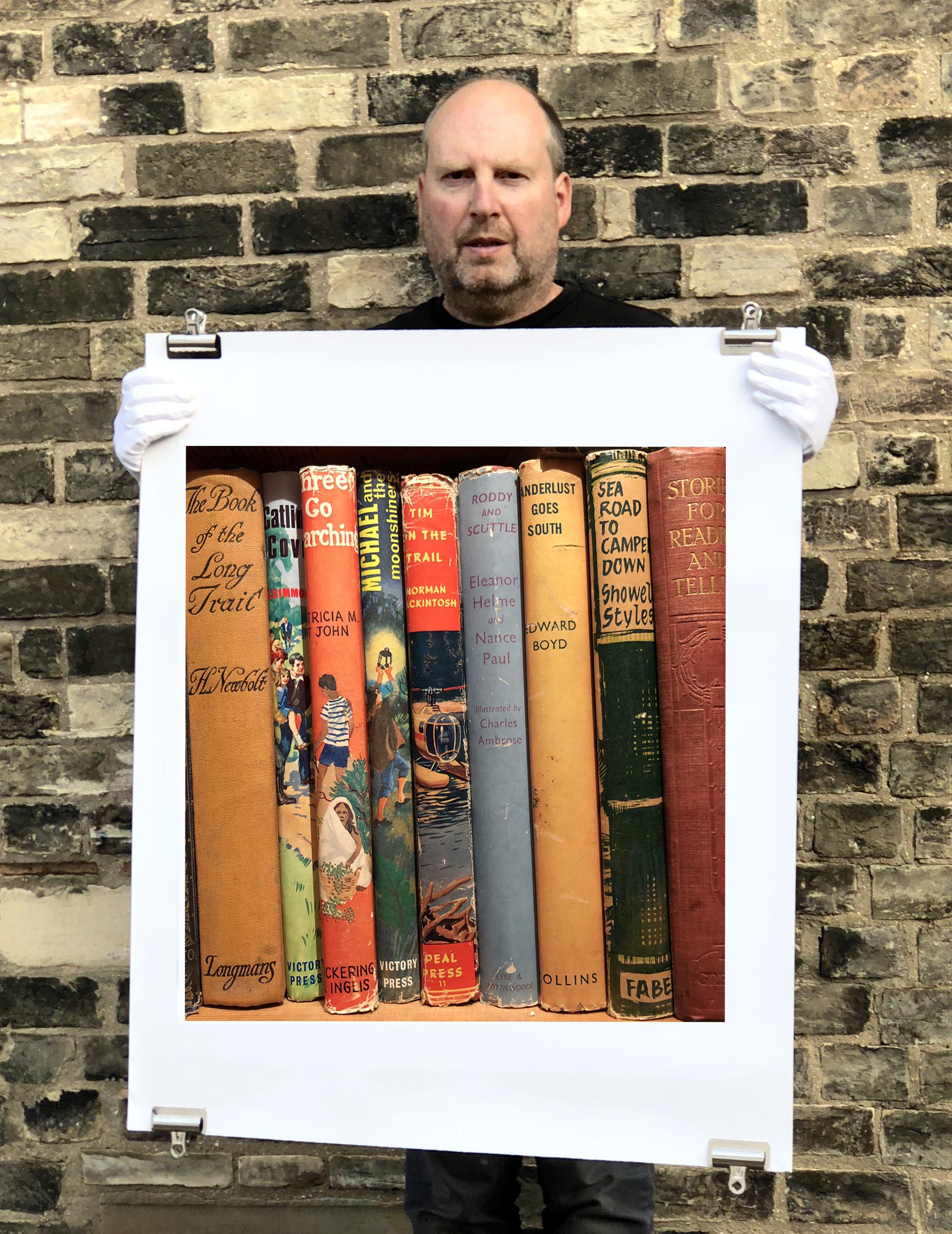 Wanderlust Goes South, features a collection of vintage book spines on a shelf in a photograph by Richard Heeps from his series In The Treasure Trove. Taken in a secondhand bookshop in Norfolk, the linear pattern is a signature style of Richard's,