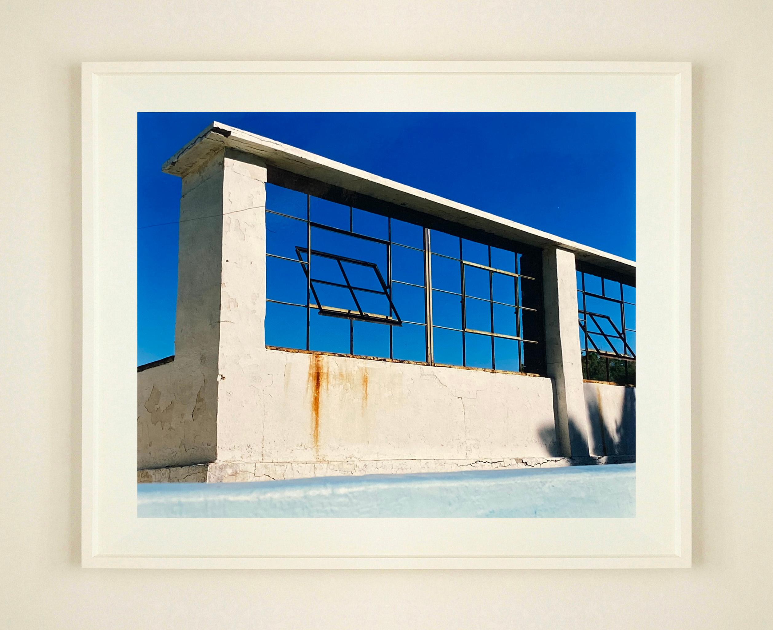 Zzyzx Resort Pool, Soda Dry Lake, California. Photograph from Richard Heeps 'Dream in Color' Series, from a California road trip, this abandoned structure against the blue sky makes a striking composition.

This artwork is a limited edition of 25,