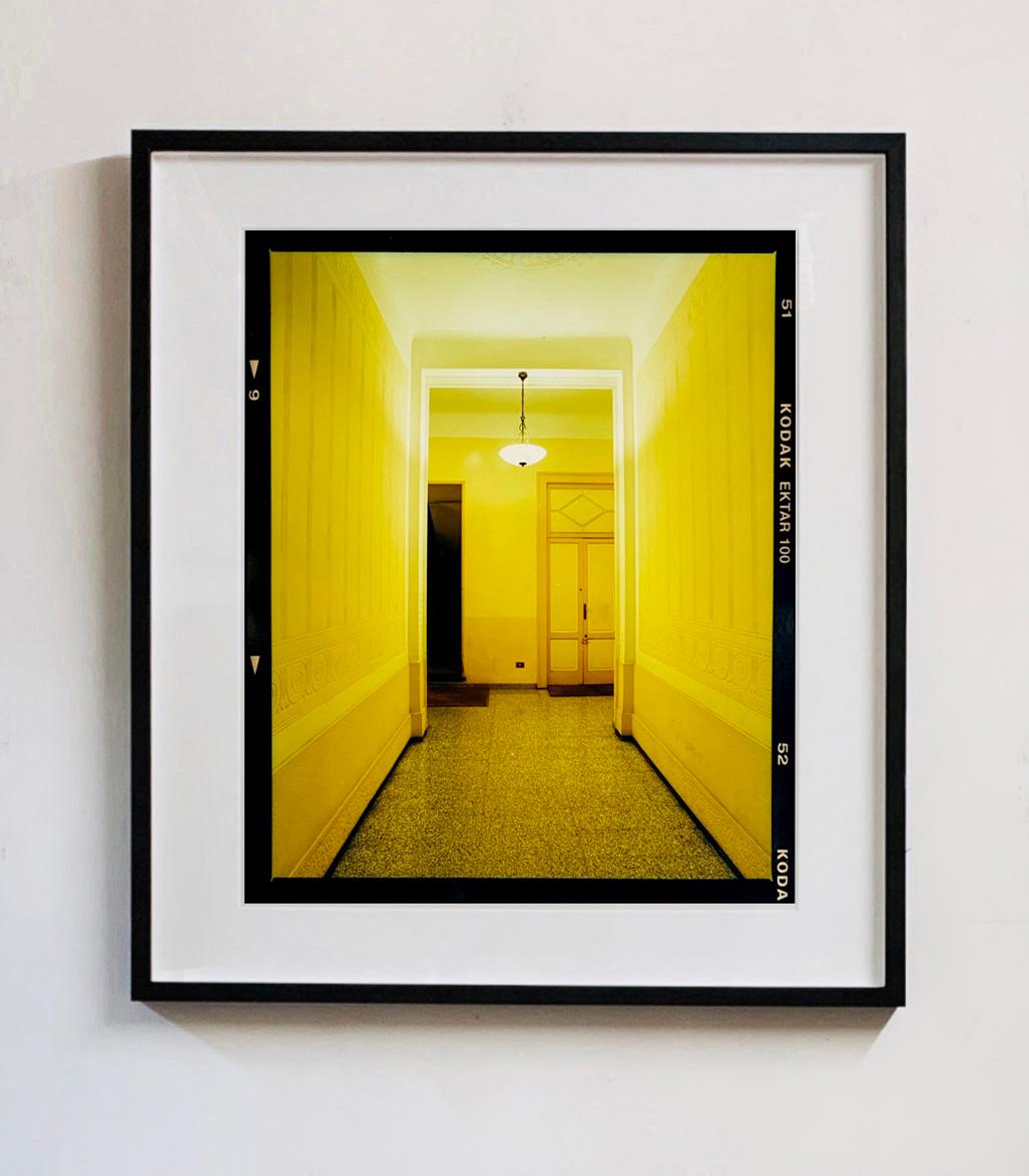 Yellow Corridor (Night), Milan - Italian architectural color photography - Contemporary Photograph by Richard Heeps