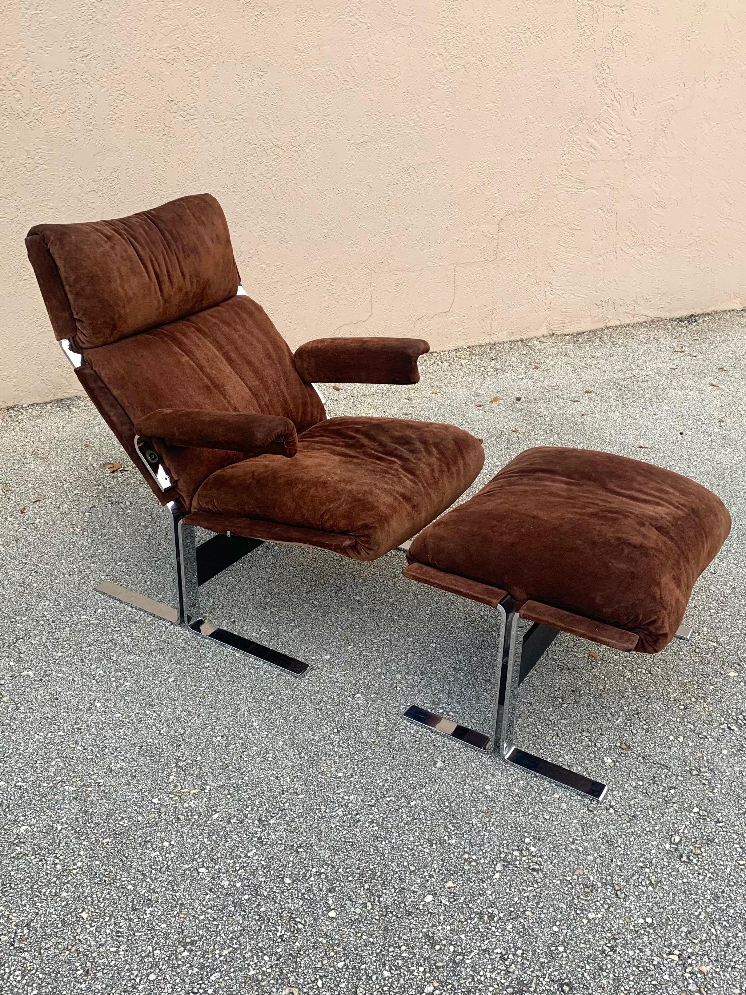 Mid Century Modern lounge chair and ottoman designed by Richard Hersberger for Pace Furniture. Chairs are upholstered in their beautiful original brown suede leather. Frames are heavy and sturdy polished chrome with a stretcher. 

The chairs are