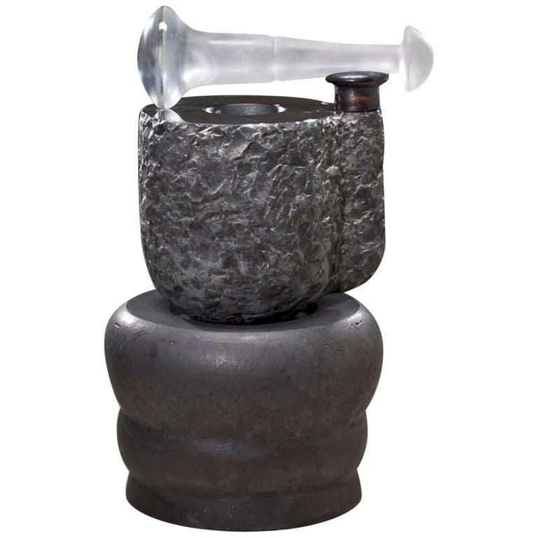 Contemporary American ceramic artist Richard Hirsch’s Black Marble Mortar and Glass Pestle Sculpture was made during 2006 – 2010. It's wheel thrown and hand built clay, black glaze, sculpted black marble and hot blown glass. “In his process, Hirsch
