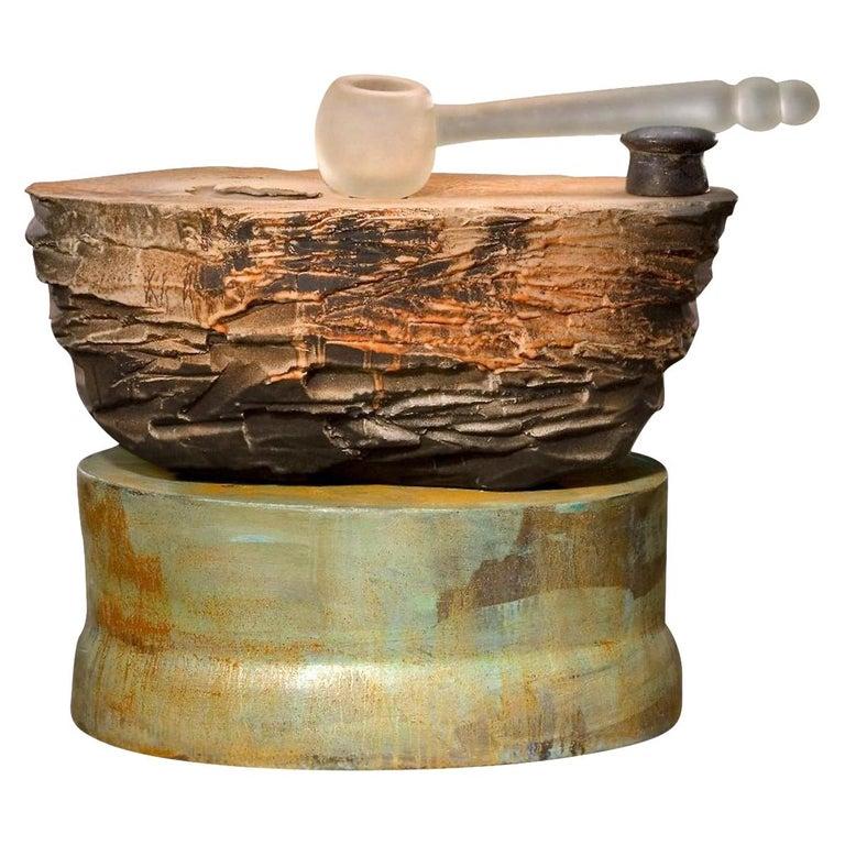 Contemporary American ceramic artist Richard Hirsch's Altar bowl with blown glass ladle #5 was assembled in 2007. It's wheel thrown and hand built clay with low fire slips and glazes, black glaze, enamel polychrome paint, raku green patina and hot