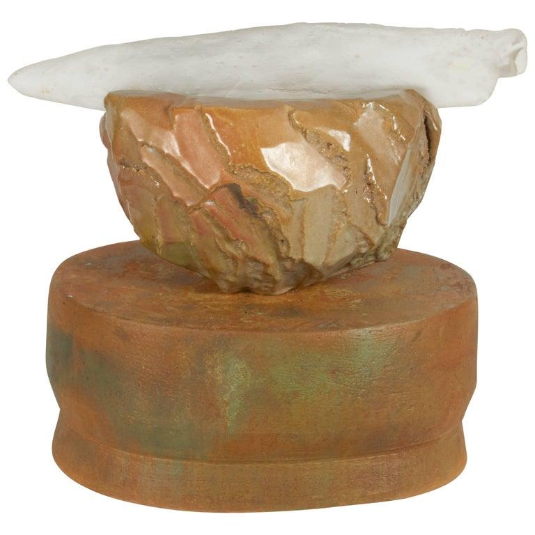 Contemporary American ceramic artist Richard Hirsch's Altar Bowl with Glass Weapon #31 is raku-fired, hand built and hand sculptured. Two separate pieces of high fired stoneware are assembled with a third piece -- a cast glass weapon. Therefore