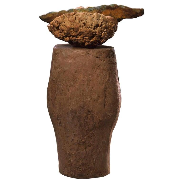 Contemporary American ceramic artist Richard Hirsch's Altar Bowl with Weapon Sculpture was assembled in 2000. It's wheel thrown and hand built clay, low fired slips and glazes, iron chloride spray, ironstone coating and raku patinas. Two separate