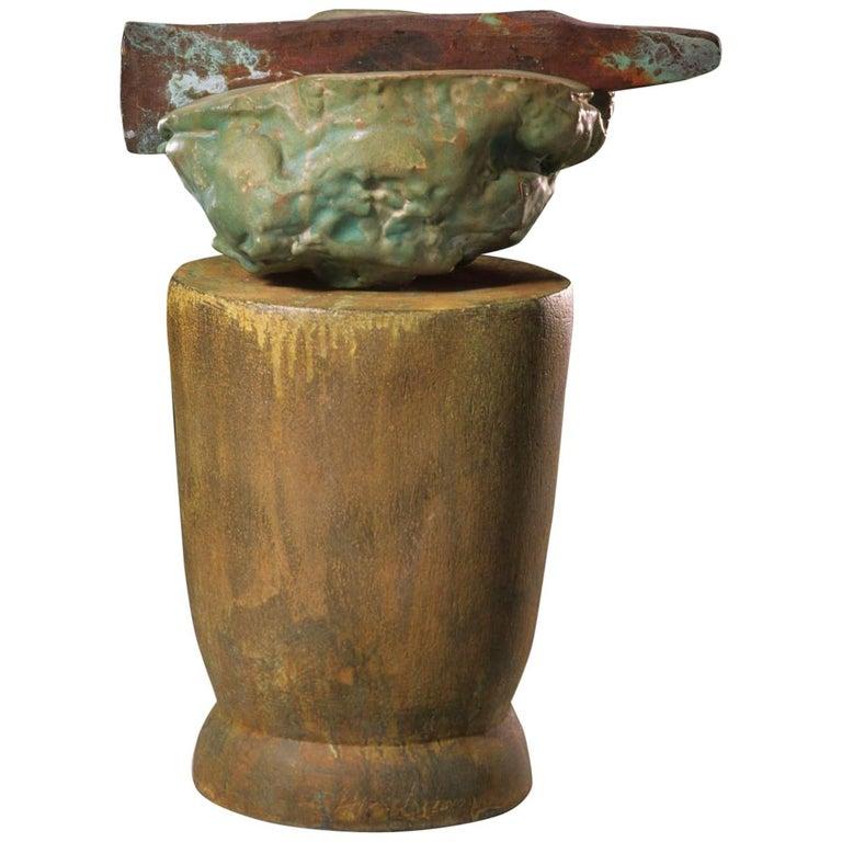 Contemporary American ceramic artist Richard Hirsch's Altar Bowl with Weapon Sculpture was assembled in 2000. It's wheel thrown and hand built clay with blue and green glazes, red terra sigillata and raku patinas. Two separate pieces of high fired