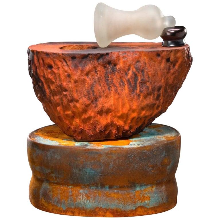 Contemporary American ceramic artist Richard Hirsch's Mortar and Glass Pestle Sculpture #23 was assembled in 2006. It's wheel thrown and hand built clay with low fire slips and glazes, raku patinas and hot blown glass. The following is an excerpt