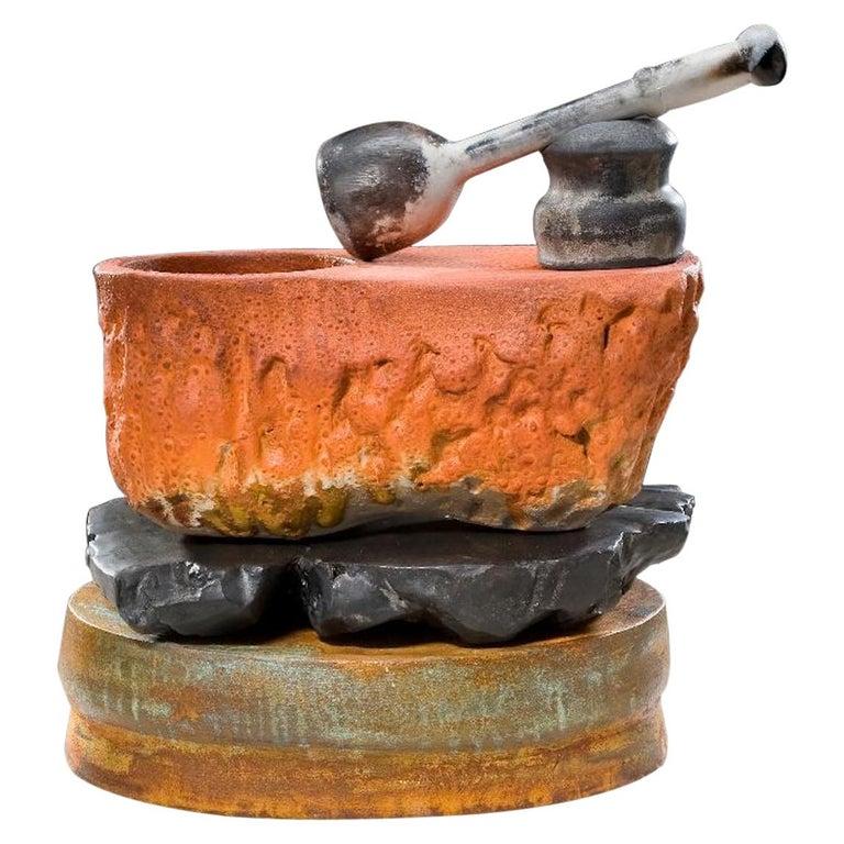 Contemporary American ceramic artist Richard Hirsch's Mortar and Pestle Sculpture was assembled in 2010. It's wheel thrown and hand built clay, lowfired slips, black glaze, raku patinas, iron chloride spray and a sawdust smoke-fired pestle. In the