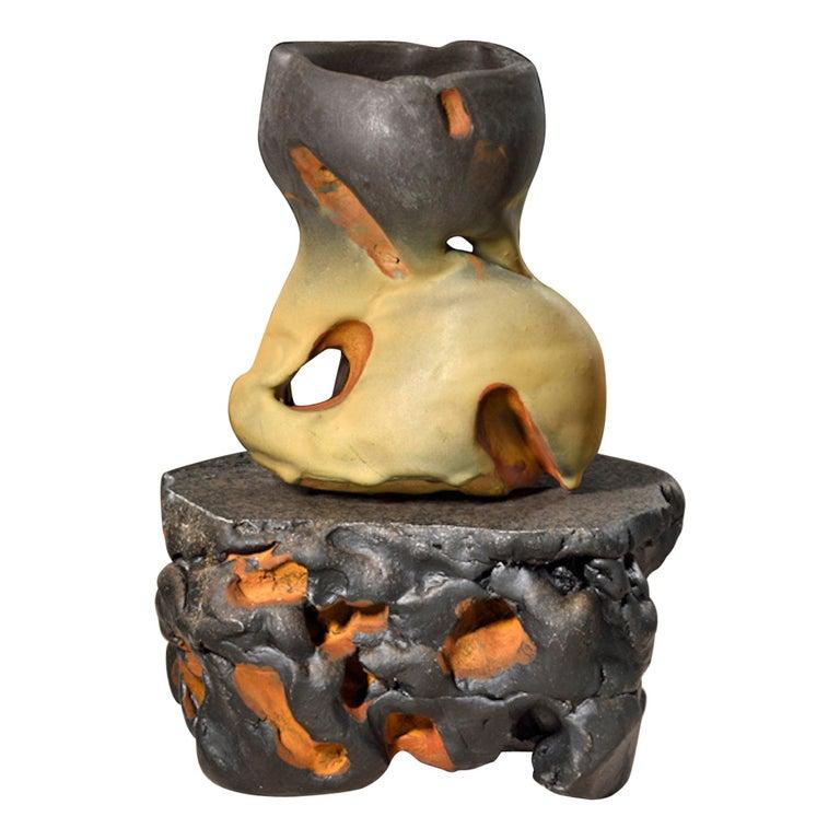 Contemporary American ceramic artist Richard Hirsch's Scholar rock cup sculpture #46 was assembled in 2018. It's wheel thrown and hand built clay, woodfired black slip, low-fired black glaze, raku rust patina and polychrome enamel paint. Hirsch