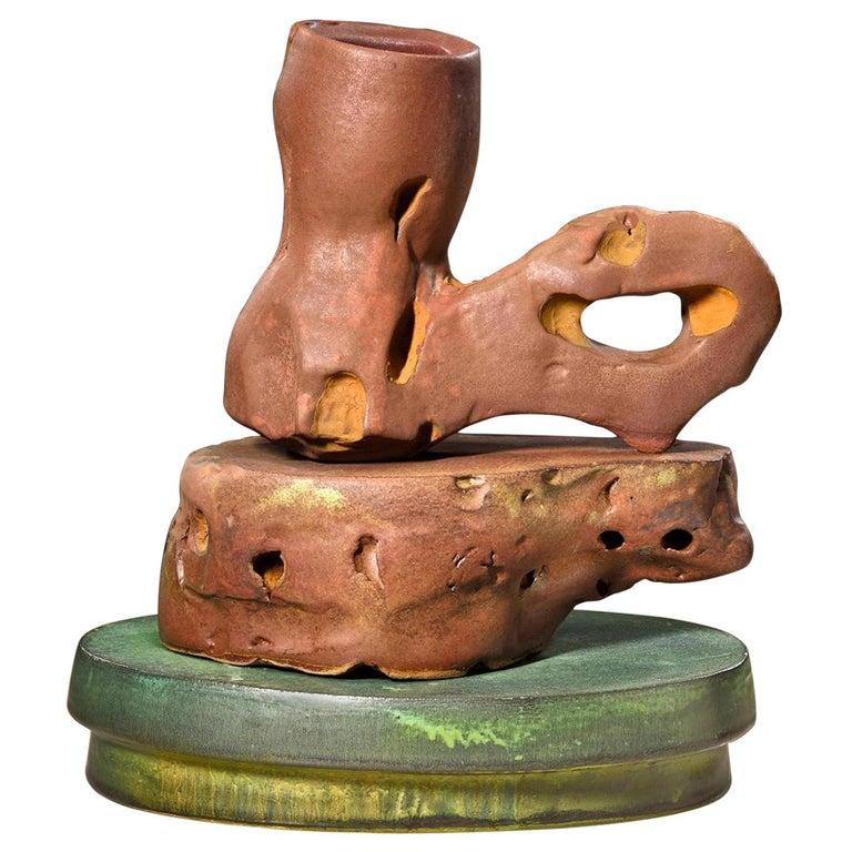Contemporary American ceramic artist Richard Hirsch's Scholar rock cup sculpture was assembled in 2018. It's wheel thrown and hand built clay with red and green glaze, raku rust patinas and polychrome enamel paint. Hirsch creates ceramic sculptures