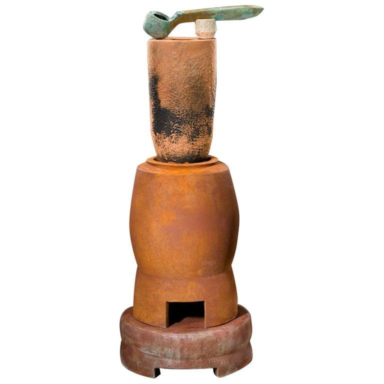 Contemporary American ceramic artist Richard Hirsch Ceramic Crucible Sculpture #1 was assembled in 2011. It's wheel thrown and hand built clay, black glaze, low fired slips and raku patinas. In the book 