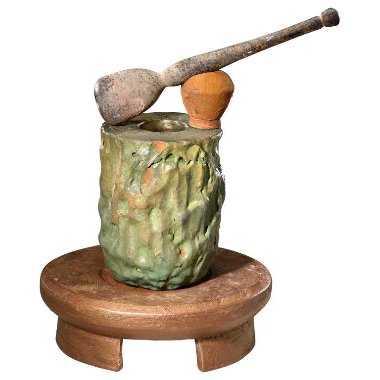 Contemporary American ceramic artist Richard Hirsch ceramic Crucible Sculpture was assembled in 2018. It's wheel thrown and hand built clay with green glaze, bronze glaze, red glaze, green patina and hot blown glass pestle with raku rust patina. In