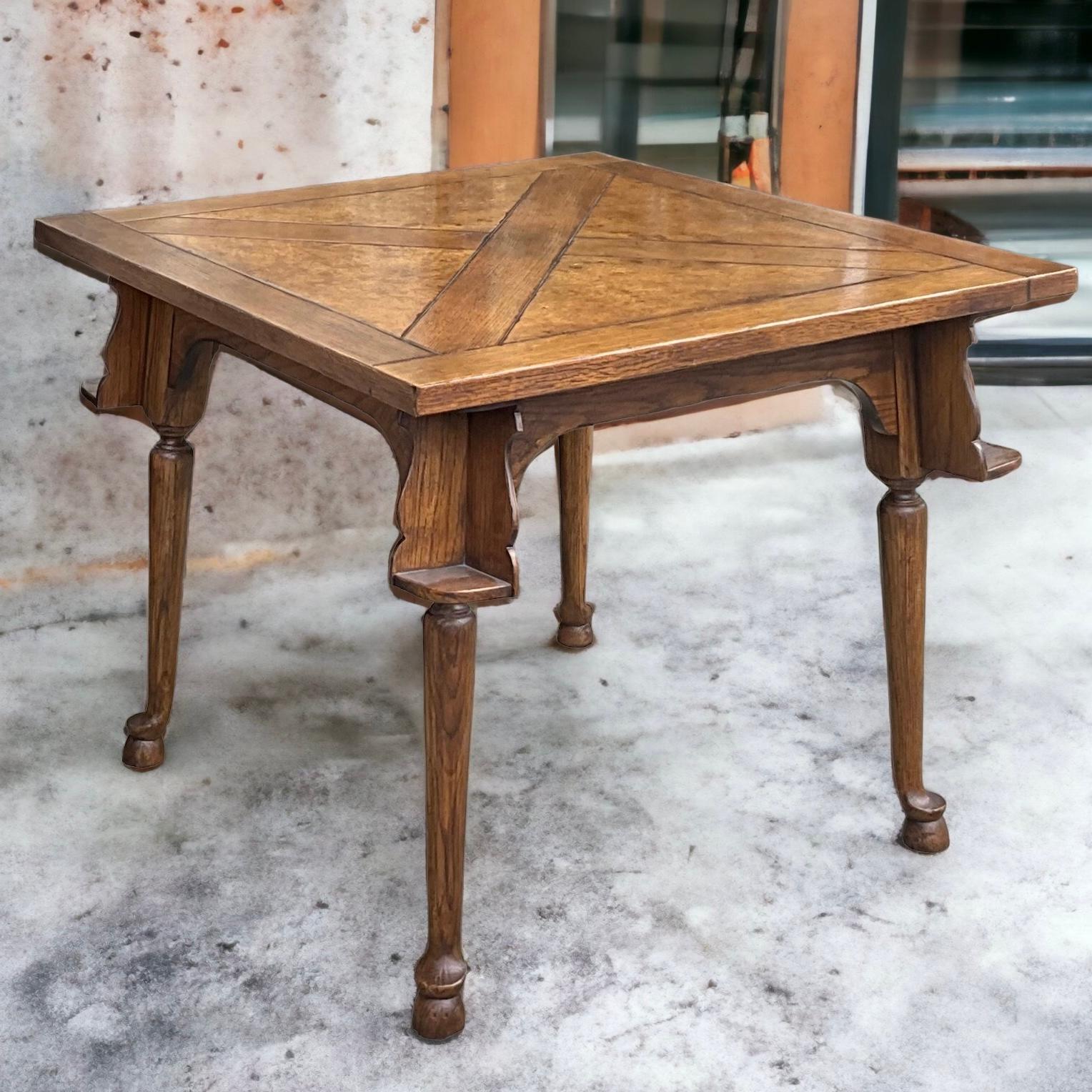 This is a rustic burl walnut and oak inlaid game table designed by Richard Honquest for Baker Furniture. It does have a dual label and is in very good condition. My favorite feature is the cup holders under the surface at each corner…genius! 