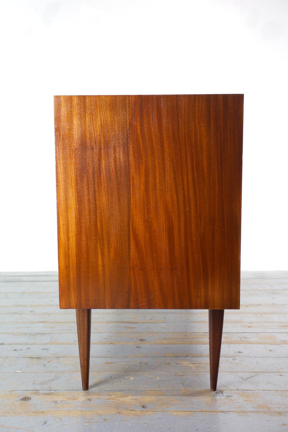 Mid Century Teak Sideboard

British Mid Century Afromosia Teak Sideboard by Richard Hornby for Fyne Ladye in the 1960s and retailed through Heals. Superb craftsmanship throughout, carved from solid from Afrormosia with beautiful cutaway handle